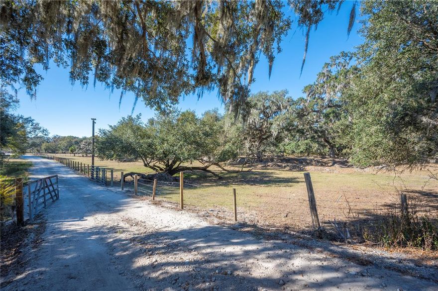 The property you are inquiring about is located in Plant City, FL, in the Fishhawk Riverhills area of Hillsborough County. This is a beautiful 13.27 acres of land that is fenced and cross-fenced. It has 2 sheds, a 50x30 metal barn built in 2024, a 12x50 front porch canopy, a swimming pool, a well, and many farm amenities that are included with the property. It has a 575 feet of driveway to the parking area, and a .3 acre parking lot that EXCLUDES the building. This is a prime location in central Florida for a potential large ranch or an additional homesite to be added in conjunction with a potential horse facility. Text or call us for more information.