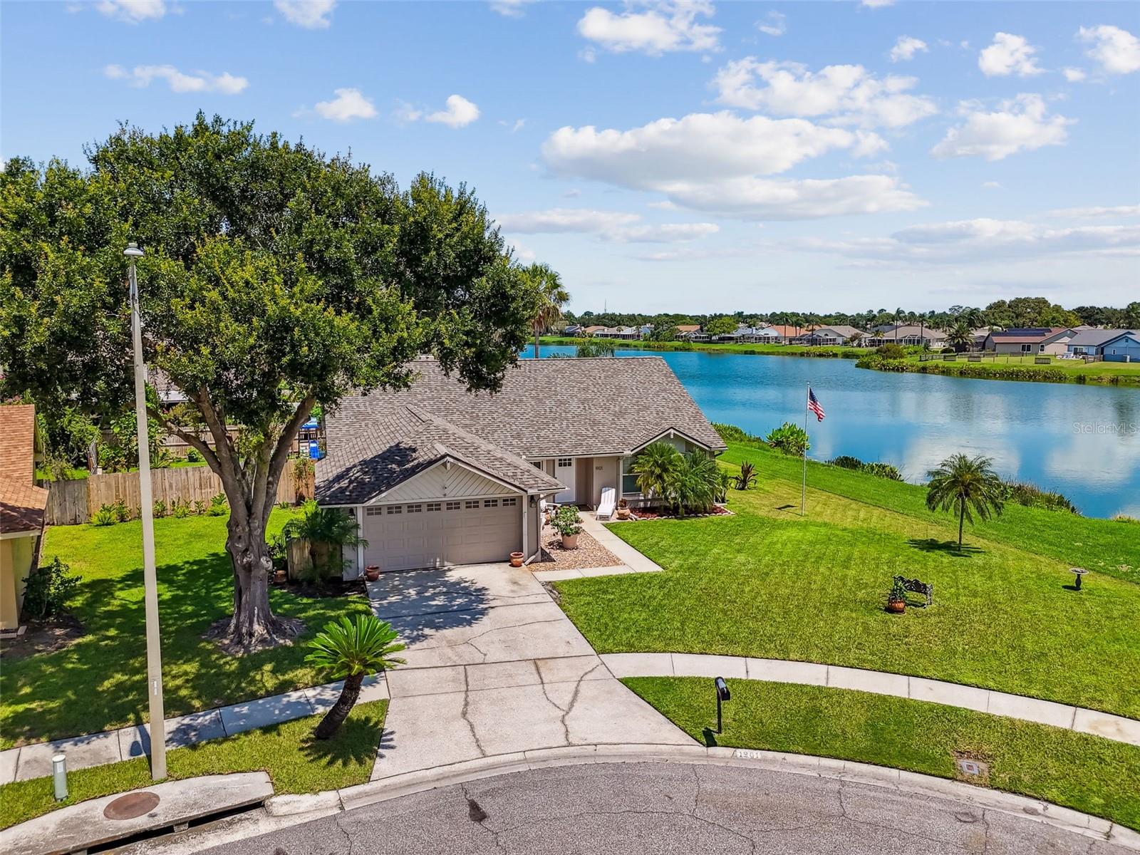 Welcome to 1901 White Cedar Way – A WATERFRONT GEM in the Heart of Brandon! Tucked away at the end of a quiet CUL-DE-SAC in the established community of WATERMILL AT PROVIDENCE LAKES, this charming 4-BEDROOM, 2-BATH HOME offers the perfect blend of COMFORT, NATURE, AND CONVENIENCE. Set on an INCREDIBLE WATERFRONT LOT, the property backs onto a 12-ACRE LAKE, creating your own PRIVATE FLORIDA OASIS where you’ll enjoy daily visits from wildlife and TRANQUIL WATER VIEWS. THREE BEDROOMS enjoy STUNNING WATER VIEWS, and one of them even opens onto the main living space - ideal as a FLEX ROOM, OFFICE, OR EXPANSION OPTION. Inside, the home features WOOD-LOOK LAMINATE FLOORING in the main living areas and primary bedroom, TILE IN WET AREAS, and CARPET IN GUEST BEDROOMS. The SPACIOUS KITCHEN offers AMPLE CABINET AND COUNTER SPACE, STAINLESS STEEL APPLIANCES, and a cozy BREAKFAST NOOK OVERLOOKING THE WATER. The SPLIT-BEDROOM FLOOR PLAN places the PRIMARY SUITE on its own side of the home. The large primary bedroom includes a WINDOW SEAT WITH SERENE BACKYARD VIEWS, perfect for morning coffee or a reading nook. The EN-SUITE BATHROOM features DUAL SINKS, A TUB/SHOWER COMBO, and PLENTY OF CLOSET SPACE. The heart of the home is the GREAT ROOM, complete with a WOOD-BURNING FIREPLACE and LARGE SLIDING GLASS DOORS that lead to a COVERED LANAI - the perfect place to unwind and TAKE IN NATURE AFTER A LONG DAY. ADDITIONAL UPDATES & HIGHLIGHTS INCLUDE: *ROOF REPLACED IN 2022 *WATER HEATER REPLACED IN 2023 *STORM PANELS FOR ADDED PROTECTION *6-PANEL DOORS THROUGHOUT *WHOLE-HOME WATER SOFTENING SYSTEM *NOT LOCATED IN A FLOOD ZONE *LOW HOA DUES & NO CDD FEES *All of this is located just minutes from BRANDON MALL, I-75, HWY 301, HWY 60, the CROSSTOWN EXPRESSWAY, and DOWNTOWN TAMPA — offering quick access to SHOPPING, DINING, HOSPITALS, MACDILL AIR FORCE BASE, TAMPA INTERNATIONAL AIRPORT, and AWARD-WINNING GULF BEACHES. This home truly has it all — STYLE, UPGRADES, LOCATION, AND PEACEFUL WATERFRONT LIVING. Don’t miss your chance to own this EXCEPTIONAL FLORIDA GEM. Schedule your private showing today — you won’t be disappointed!