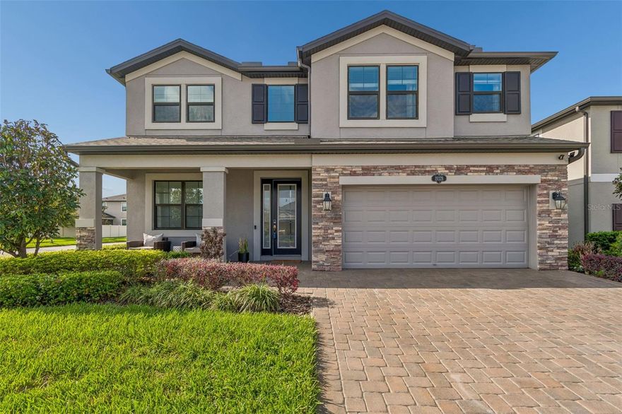 Welcome to the beautiful corner-lot pool home offering elevated design, expansive living, and seamless entertaining in The Reserve at Long Lake Ranch. Featuring 5 bedrooms, 3 full bathrooms, 3 car tandem garage, a spacious upstairs bonus room, and 3,531 square feet of thoughtfully designed living space, this fully fenced residence sits on a nearly 0.18 acre lot. Step inside to long entryway, high ceiling and a dramatic show stopping chandelier that sets the tone for a home that feels grand yet inviting. Tile flooring, a soft neutral palette, and new designer lighting throughout create a model-like presentation. The open-concept layout is anchored by a chef-inspired kitchen featuring granite countertops, modern finishes, a large island, tile backsplash, stainless steel appliances, a Butler’s pantry perfect for a coffee bar or entertaining station, and a large walk-in pantry for exceptional storage. Designed with both functionality and style in mind, the kitchen flows seamlessly into a spacious family room filled with natural light, creating the perfect setting for everyday living and entertaining. The flexible floor plan also includes a separate formal dining room and a full bedroom and bathroom downstairs, ideal for guests. Upstairs, the oversized bonus room offers endless possibilities as a media room, game room, or additional lounge space. The large oversized primary suite serves as a private retreat, offering generous space, comfort, and upgraded finishes, while the additional bedrooms provide versatility for family and guests. Outdoor living is equally impressive with a saltwater pool, and a beautifully paved outdoor living area — ideal for relaxing or entertaining while enjoying serene pool views. Additional features include whole-home water softener, separate laundry room, and abundant storage. Residents enjoy access to exceptional community amenities including a resort-style community pool, walking trails, conservation areas, a 40-acre lake for fishing, playgrounds, and sports courts — all conveniently located near Tampa, premier shopping, dining, and the Gulf beaches. Also school of choice nearby are Skybrooke K-8 and Imagine School of Land O Lakes (charter school). Perfectly positioned in a prime location, with A rated school zones, this exceptional residence blends a beautifully designed interior, inviting outdoor living, a spacious homesite, and the elevated lifestyle today’s buyers are searching for! Schedule your private showing today!