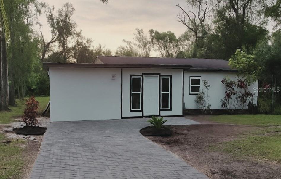 This 4-bedroom, 2-bath home is located in the heart of Sanford, close to shopping, schools, and entertainment. A welcoming paver driveway leads you to the entrance, setting the tone for the fresh updates you’ll find inside. Modern lighting, hard surface countertops, and a sleek glass-enclosed shower add a stylish touch throughout. The open floor plan makes daily living easy, while the spacious backyard is perfect for entertaining, family fun, or simply relaxing. Move-in ready and waiting for you!