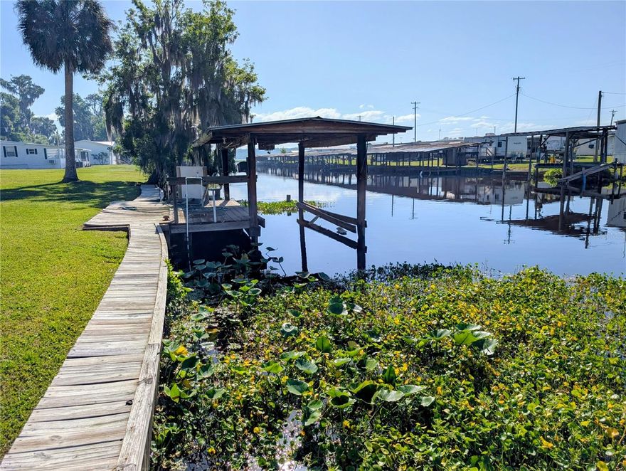 Calling all fisherman!! This is the location you'll love to hit all the hot spot lakes along the St. Johns River!! South of Astor, this large 3 bedroom 2 bath home is beautiful, furnished, and has a huge screened back porch overlooking the water. This home has been beautifully remodeled with solid surface countertops, nice luxury vinyl flooring and some tile. The huge kitchen has lots of counter space, storage, and a butcher block countertop island!! Come take a look today! Move in ready!!