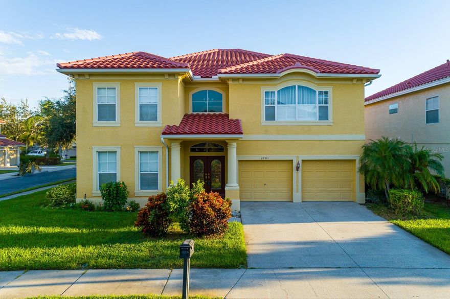 One or more photo(s) has been virtually staged. Welcome to this bright and spacious 4-bedroom, 3.5-bath + bonus room POOL home in the highly sought-after GATED community of Highland Woods—one of the rare gated neighborhoods in Dunedin! Offering a BRAND NEW TILE ROOF ($50K)-(2024), renovated master bath (2024), new first-floor laminate flooring and wood stairs (2024), new railings (2025), new rain gutters (2025), resurfaced kitchen and bath cabinets (2024), new water softener (2025), and more—this home is truly move-in ready.  Nestled on a 70x130 (.23 acres) corner lot, this 3,491 sqft home offers a perfect blend of comfort, style, and functionality for modern family living. Step inside to a desirable open floor plan featuring a large family room with soaring ceilings, a separate living and dining area with crown molding, and a beautifully updated kitchen with newer LG stainless steel appliances, gas cooking, granite countertops, wood cabinetry, and a stylish backsplash. The spacious downstairs master suite boasts tray ceilings, a newly renovated luxurious master bath with double sinks, granite countertops, and a relaxing garden tub. Sliding pocket doors open from both the master and family room to the screened lanai and saltwater pool, framed by Areca palms for privacy—perfect for seamless indoor/outdoor living. Upstairs, enjoy laminate flooring throughout and versatile spaces including an open loft that can easily become a private office with French doors, a huge bonus room with double doors to contain kids’ activities, and generously sized bedrooms. A loft landing overlooks the family room, adding to the home’s bright, airy feel. With a three-car tandem garage, newer air conditioners (2020 and 2021), a gas water heater (2021), and a saltwater pool system, and a freshly painted garage floor (2021) this property combines luxury and efficiency. Centrally located, this home offers easy access to shopping, medical facilities, and a variety of restaurants, as well as the stunning beaches of Honeymoon Island, Caladesi Island, and Clearwater Beach. Enjoy nearby golfing, the charm of Downtown Dunedin with waterfront dining and cozy bistros like Bon Appétit and Clear Sky Draught Haus, and outdoor adventures along the Pinellas Trail. On Saturdays, explore the popular Dunedin Market with crafts and live music, plus a full calendar of fun family-friendly festivals throughout the year. With no carpet, abundant natural light, a floor plan designed for modern living, and access to top-rated schools, this home truly offers the best of convenience, comfort, and lifestyle.