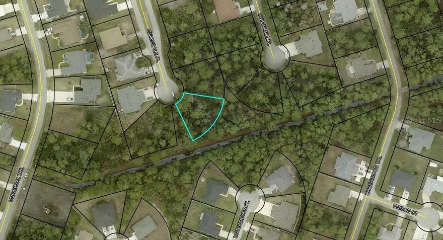 Discover the perfect canvas for your future home at 31 Uniondale Place, a beautifully positioned pie-shaped lot tucked at the end of a quiet Palm Coast cul-de-sac. This unique homesite offers extra width at the rear, giving you more flexibility for your ideal floor plan, outdoor living spaces, or a spacious backyard retreat.
Set within a peaceful neighborhood, this property provides the privacy of minimal traffic while still keeping you close to Palm Coast’s best—parks, walking trails, shopping, dining, and a short drive to the beach.
Whether you envision a modern coastal build, a cozy retreat, or a family-friendly layout, this lot gives you the freedom to create the home you’ve always wanted.