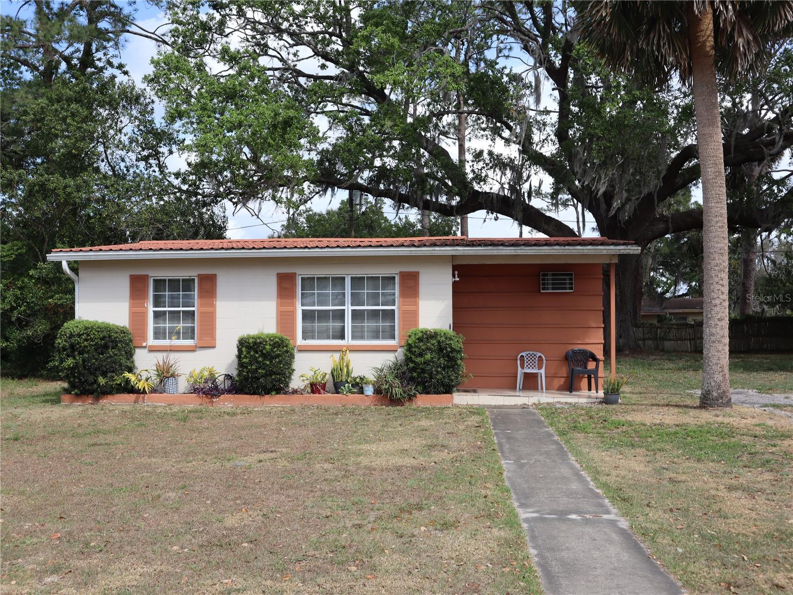 Metal Roof just a few years old ! What a Cutie 1 Bedroom 1 bath PLUS Bonus ROOM 10x9 WITH AC wall unit! Living and dining room combined off the kitchen with range with window over looking back yard. Screen Porch plus a patio area and laundry room off back Beautiful back yard with huge tree to enjoy the outside with the shade. Across the street is Deltona Plaza with lots of stores and business with a great Waffle Restaurant! Items that have been updated Hot Water Heater , Electrical Breaker Panel , Windows changed out. Move in Ready!