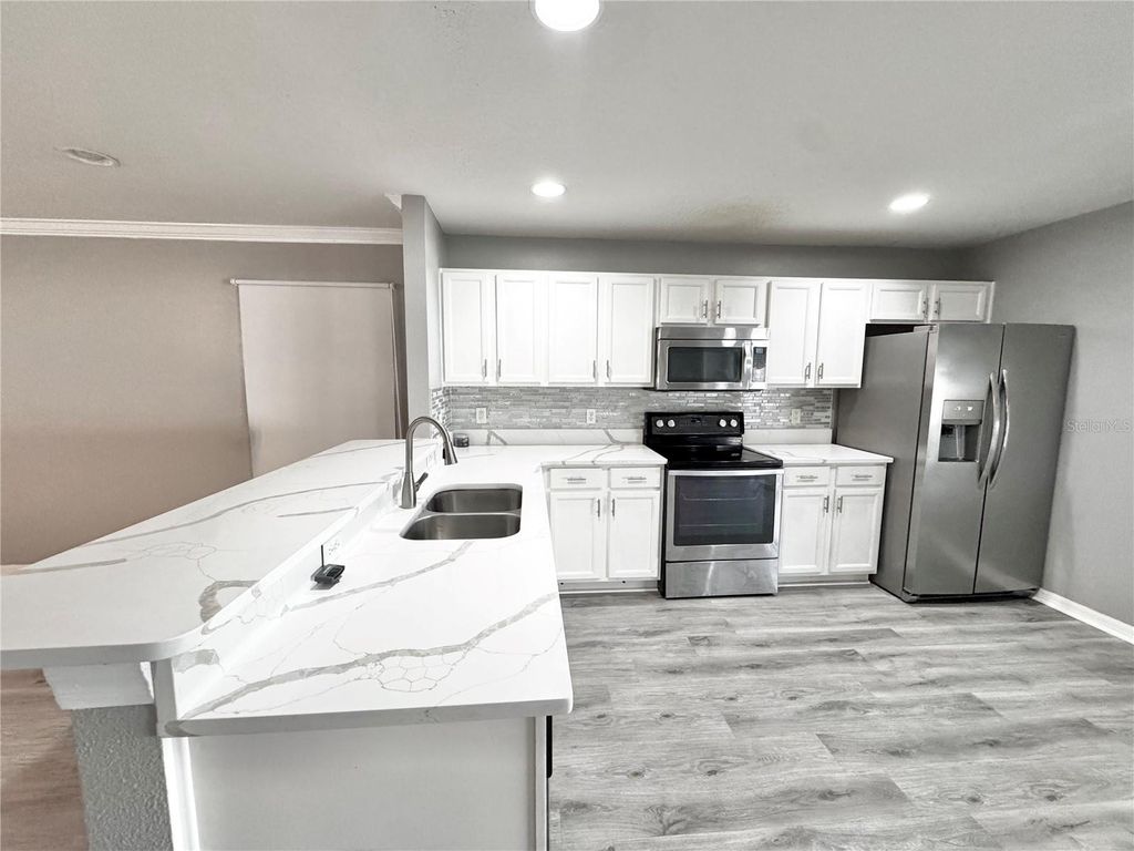 Photo of 501 Flower Fields Lane, Orlando, FL 32824 (MLS # S5140241)