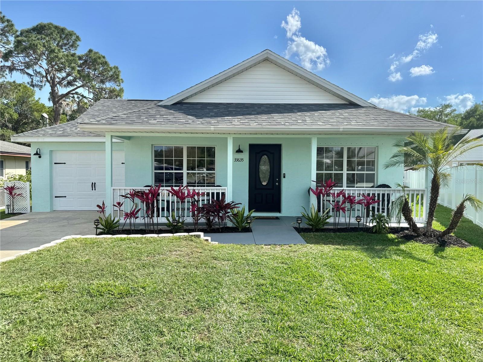 CANAL WATERFRONT HOME !! PRIVATE DOCK !! MOVE IN READY!! OPEN-AIR BOAT HOUSE WITH LIFT !! ADDITIONAL DOCK SITTING AREA !! DIRECT ACCES TO LAKE EUSTIS AND THE FAMOUS CHAIN OF LAKES !! NO HOA!! NEW STANDOUT DÉCOR FINISHES !! Here it is !! Your VACATION GETAWAY or your FOREVER HOME !! Now’s the time to fully immerse yourself and truly experience that “Florida serene” CANAL FRONT LIVING lifestyle that will guide you on limitless NAUTICAL ADVENTURES !! This 2005 home has charm, style, sophistication, and tucked away on a quaint cul de sac!! ENTICING CURB APPEAL and lovely manicured landscaping!! NUMEROUS FEATURES INCLUDE: NEW ROOF 2022, NEW EXT. PAINT 2024, PARTIAL NEW WOOD-LIKE LAMINATE FLOORING 2025, CUSTOM SPA 2024, EXTENSIVE LANDSCAPE LIGHTING 2024, CUSTOM HURRICANE SHUTTERS, CENTRAL VAC, INSIDE LAUNDRY W/CABINETRY, DUAL AC, 2024 FIRE PIT TABLE, AND ALSO HAS AN OUTDOOR WATER SOFTENER SYSTEM !! This EXCEPTIONAL 4 bed/3 bath home has 1,980 climate-controlled sq. ft. and boasts a UNIQUE AND VERSATILE FLOOR PLAN that includes TWO MASTER EN SUITES!! Both with walk-in closets. The welcoming FRONT PORCH exudes that restful vibe to simply relax sipping iced-tea!! Upon entry, natural light fills the foyer!! The “chef friendly” kitchen has stunning GRANITE COUNTERTOPS, SS appliances, Induction Stove, ABUNDANT CABINETRY with under mount lighting, elegant BACKSPLASH, and teardrop PENDANT LIGHTING!! The DINING ROOM along with the granite breakfast bar provides more than ample seating!! Adjacent, is the LIVING ROOM complete with a media closet!! The front of the home has a Master En Suite and Guest Room, with a close by BONUS ROOM that could serve as an OFFICE/HOME THEATRE or CRAFT ROOM!! The rear portion of the home has been RECENTLY UPGRADED with IMPRESSIVE laminate flooring, a custom ARTIST’S NICHE WITH NEW AMBIENT LIGHTING, the second Master En Suite, and the additional “eye-catching” EXPANSIVE Guest Room with a NEW BARN DOOR DESIGN!! Plenty of room for In-Laws or long-term guests!! BOTH EN SUITES HAVE ACCESS TO THE LANAI !! Rear bedrooms have BEAUTIFUL SCENIC CANAL/YARD VIEWS !! Step out onto your approx. 9 X 30 SCREENED LANAI and absorb all the tropical-like landscaping, as you lounge in your custom SPA or choose the COZY SITTING AREA complimented with a PROPANE FIRE PIT TABLE!! Perfect for outdoor entertaining and all those family gatherings!! Sooth away your day in the backyard oasis GREEN SPACE with MORE LUSH LANDSCAPING, CUSTOM LIGHTING, and a MULTITUDE of plants/trees including Avocado, Mango, Pineapple, Grapefruit, Key Lime, and Barbados Cherry just to name a few!! PLUS, ANOTHER SITTING AREA with WOOD-BURNING FIRE PIT and a generous sized WORKSHOP/LAWN/STORAGE SHED with electric!! And of course, your little piece of paradise awaits you!! YOUR VERY OWN PRIVATE SHINGLED OPEN-AIR BOAT HOUSE WITH LIFT !! Don’t miss this RARE opportunity!! SELLER INCLUDING 2 YR HOME WARRANTY!! Location benefits include convenient drive to Theme Parks, Daytona Beach, shopping, Worship, and Historic Downtown Mount Dora Art & Craft Festivals!!