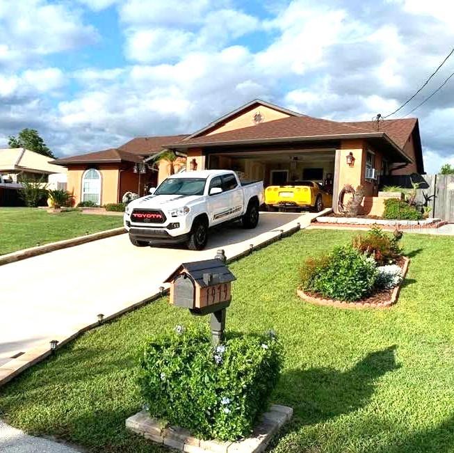 Lovely immaculately kept 3-bedroom 2 bath home in Deltona Florida. Open floor plan includes living room fireplace, ceiling fans though-out, remodeled to include Crown moldings, Laminate flooring, new thermal pane windows, hurricane shutters, Lighting, nest thermostat, HVAC is 5 years new, Roof in 2020, New exterior paint and much more. There is a 2-car attached garage 21ft by20 feet, with sink and counter, built-in storage, New insulated garage door opener, and storage. Large screen room out back with new pavers, Pool has new screen enclosure, Pool is solar heated, new in 2020. Back yard has terraced gardens and is fully fenced in. There are 2 storage sheds with electric. The grounds are immaculately maintained with lovely plants and shrubs. Call today for your appointment to tour this property.