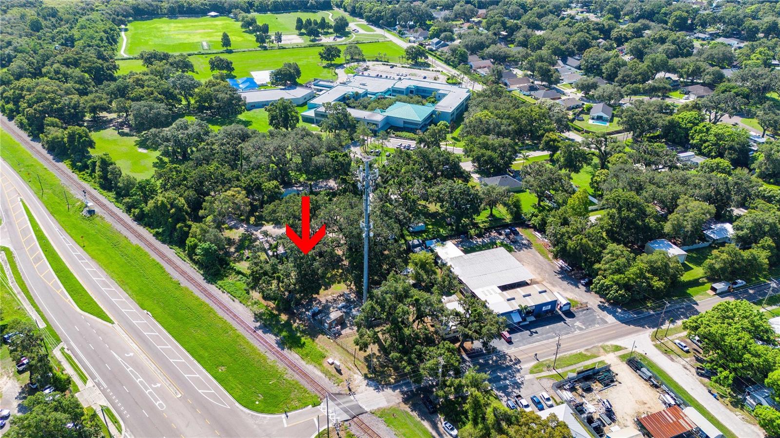 COMMERCIAL SITE FOR SALE. Just shy of one acre. Site is fenced with high chain link fence and roll gate. Well on site. Two buildings located on site. The blue building is a steel metal building with electric run, ready for an office. Borders MLK and the railroad. Other side is the cul-de-sac for Colson Elementary. Plenty of parking.
