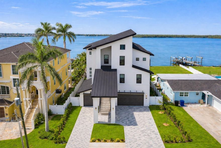 Built in 2024, this elevated modern coastal residence offers expansive, unobstructed open water views and high-and-dry construction in one of St. Petersburg’s most desirable waterfront settings. Lightly lived in and meticulously maintained, the home presents in pristine, like-new condition.

With approximately $500,000 in upgrades, it showcases high-end appliances, designer finishes, clean architectural lines, and open-concept living spaces filled with natural light, creating a seamless blend of sophistication and comfort.

The expansive waterfront backyard offers a rare opportunity to design a custom resort-style pool and outdoor living space, thoughtfully positioned to take full advantage of the tranquil water views. A private dock, completed in 2023, enhances the waterfront lifestyle—perfect for boating, relaxing, and enjoying direct water access.

Ideally situated in a quiet waterfront location, yet just approximately 14 minutes from downtown St. Petersburg’s acclaimed dining, shopping, and vibrant waterfront attractions.