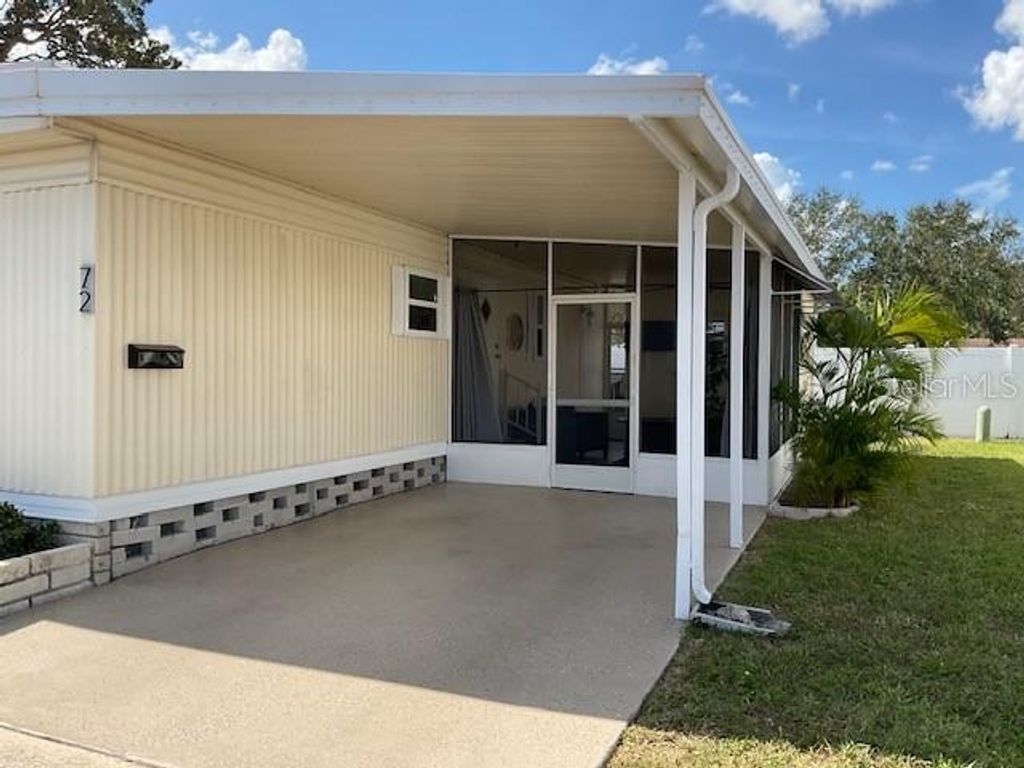 Photo of 72 Pindo Palm Street W, Largo, FL 33770 (MLS # TB8464330)