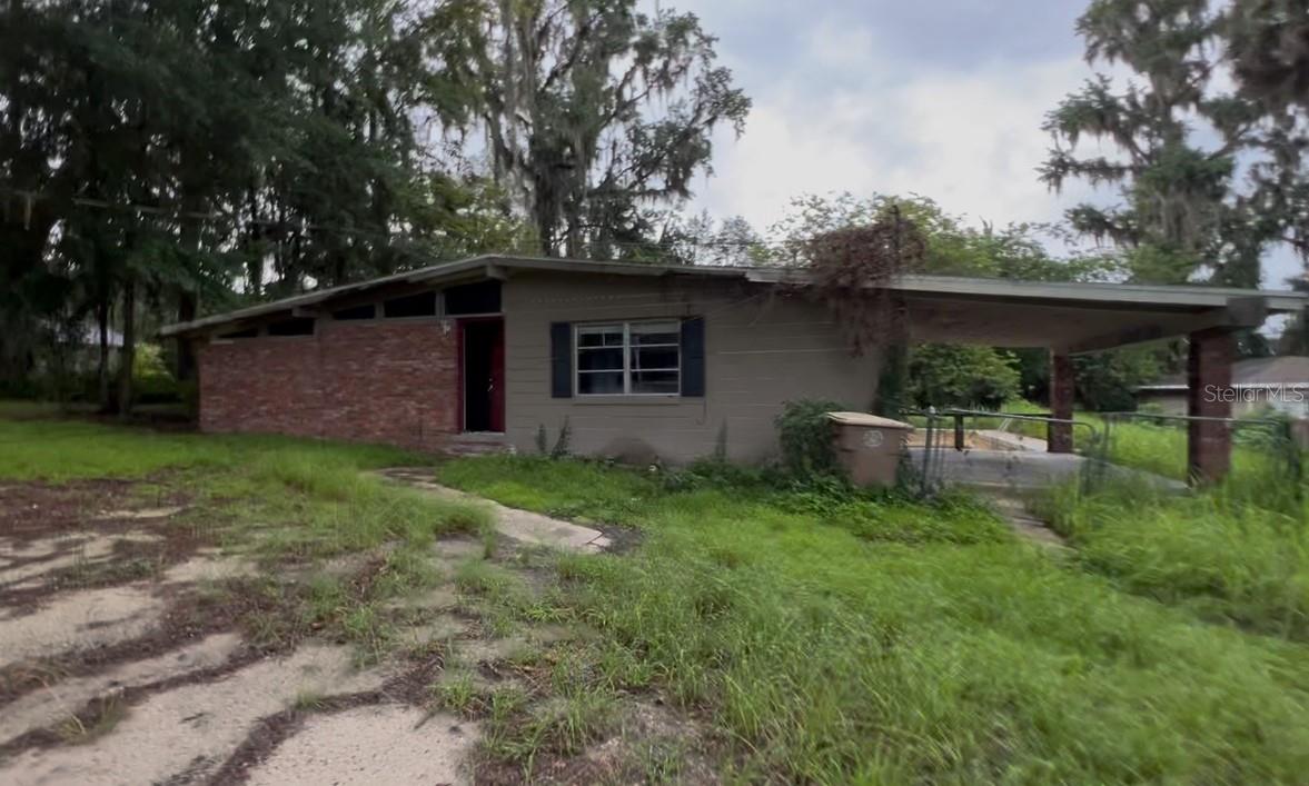 This charming 3-bedroom, 2-bathroom block pool home at 627 SE 24th St, Ocala, FL, offers incredible value with a spacious and versatile layout. Featuring two distinct living areas, a private master suite, and original hardwood floors throughout, this property sits on a generous 0.46-acre lot with block construction and vaulted ceilings for added character and durability. Enjoy relaxing by your private pool or entertaining in the expansive backyard, complete with mature landscaping. The home also includes a convenient carport and large bedrooms that provide plenty of space for family and guests. Located in a quiet residential neighborhood with low crime rates, this property is just minutes from downtown Ocala, shopping centers, Silver Springs State Park, and the World Equestrian Center, with easy access to I-75. Priced at $169,900 with an After Renovation Value of $315,000–$335,000, this is a rare opportunity for both investors and homeowners to own a solid home in a highly desirable area with strong upside potential. Needs work - cash only. Solid profit for an investor.