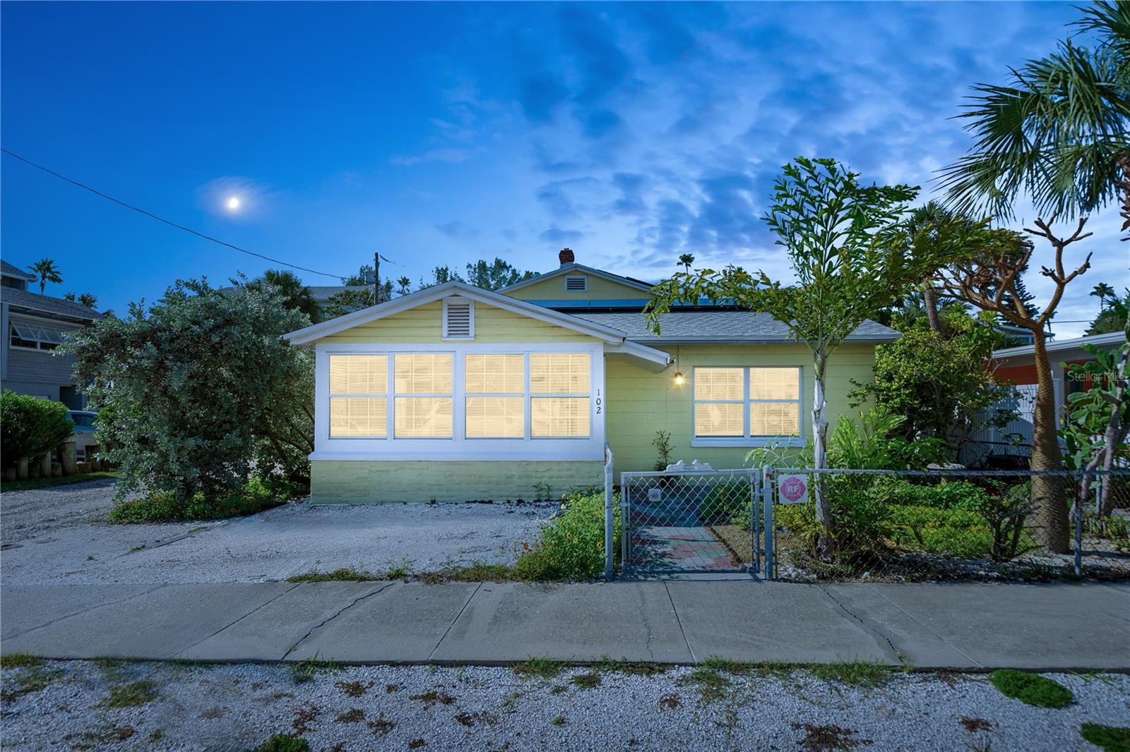 Welcome to this impeccably maintained, move-in ready mid-century gem! This unique property, officially a triplex, offers a main house, a two-bedroom apartment over the garage, and a newly built ground-floor bonus one bed/bath guest suite. The main house features two bedrooms and one bath, with porcelain tile floors throughout and original wood ceilings in the versatile Florida room, perfect as a den, dining, or family room. The updated kitchen retains the home’s charming character, providing ample space for family gatherings and entertaining. The 2nd floor garage apartment includes two bedrooms and one bath, a sunroom with abundant natural light, and stunning views of the Bay. Recent renovations created a large two car garage, laundry room, and a ground-floor guest suite, including a large bathroom with walk-in shower, kitchenette, and bedroom. The renovation also replaced all wiring, raised the garage and lower apartment floors with slab cement, replaced the property’s main sewer line, and added two mini-split systems for efficient cooling. Lovingly maintained by the same family for 21 years, the property has seen numerous respectful modifications, including two new central HVAC systems, three newer hot water heaters in the garage, and new roof with solar panels installed in 2022 for minimal power bills. The front and back patios are graded and surrounded by native plantings, featuring an outdoor shower and a tiled table and beaches for entertaining. Both apartments boast new southern windows, porcelain tile floors and LVT flooring upstairs, adding to the property’s charm and character. Nestled on a quaint street in Pass-a-Grille Beach, this home is just one block from the beach, Merry Pier, Historical Museum, and a short walk to shops and restaurants. Come soak up the sun, and enjoy the white sandy Gulf beaches and breathtaking sunsets. Don’t miss this opportunity to call this beautiful property your home!