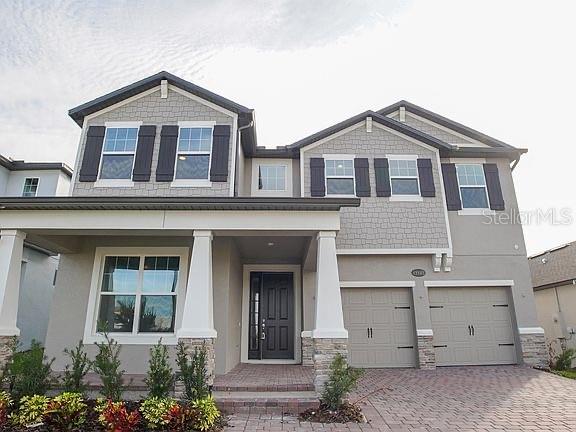 Lots of Upgrades. Corner lot backing up to pond and Lake Mac with walking paths. Coastal wraparound covered lanai AND balcony! Incredible views! Plenty of room for pool. Double master floor plan - one upstairs and one downstairs. Open concept floor plan perfect for entertaining. Gourmet kitchen with cabinets to the ceiling, glass accent doors, navy island, gold cabinet hardware, butlers pantry and large walk-in pantry. Loft/gameroom upstairs for additional entertaining space. This home is built to save you by being built to Energy Star 3.1 standards and is third-party rated for energy efficiency.