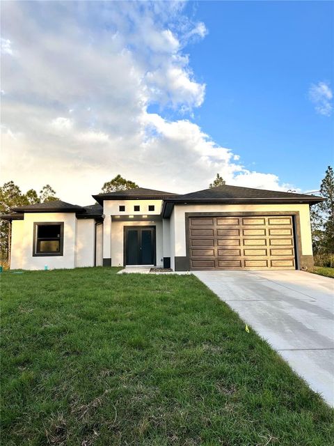 316 MOORE AVENUE LEHIGH ACRES FL 33936