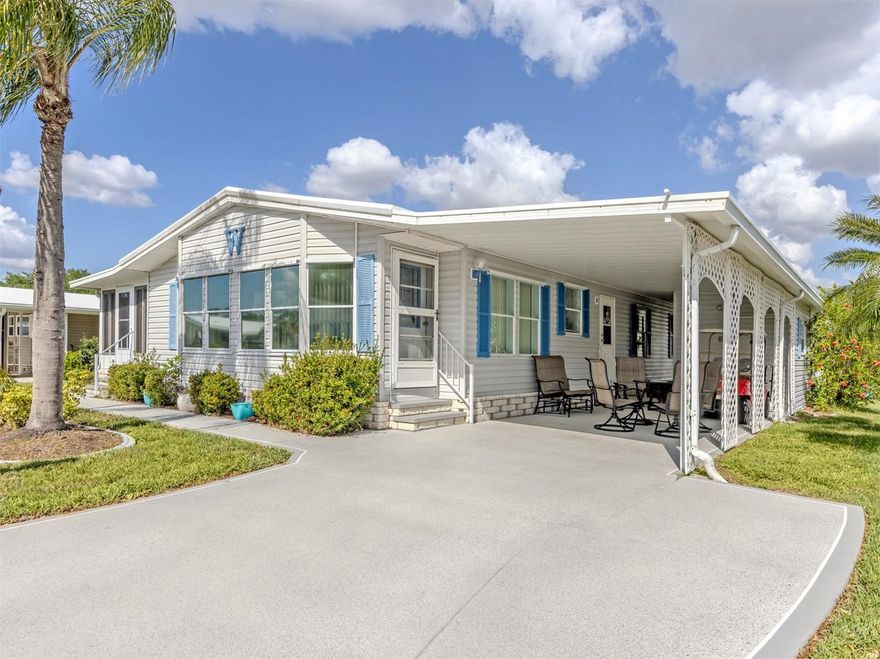 Welcome to easy Florida living in this well-maintained 1995, 2-bedroom, 2 bath manufactured home, ideally situated on a desirable corner lot in the highly sought-after, land-owned, pet friendly community of Harbor Isles. Perfectly positioned directly across from the marina, this home offers both a prime location and a relaxed coastal lifestyle. Step inside to discover a bright and spacious floor plan featuring vaulted ceilings throughout and 1,280 square feet of comfortable living space. The large kitchen is a true centerpiece, offering abundant cabinetry and counter space, all open to the expansive dining and living areas—perfect for entertaining or everyday living. Just off the living room, a beautiful Florida room spans the entire length of the home and is equipped with acrylic windows, luxury vinyl flooring, and its own AC, creating a versatile space to enjoy year-round.
Both bedrooms are generously sized and feature large walk-in closets, while the two spacious bathrooms include skylights that fill the spaces with natural light along with ample storage. Additional highlights include a 2022 AC system, a large shed with newer washer and dryer, two workbenches for hobbies or projects, and a golf cart that is included with the home. Being offered turnkey furnished, you can move right in and start enjoying the Florida lifestyle immediately. Harbor Isles is a vibrant, amenity-rich waterfront community offering a marina with direct access to the Intracoastal Waterway and Gulf of Mexico, a large clubhouse, heated pool and spa, fitness center, tennis and pickleball courts, bocce, shuffleboard, and a full calendar of social activities. This active and friendly community is conveniently located near shopping, dining, beautiful Gulf beaches, and historic downtown Venice. This is your opportunity to own a piece of paradise in one of the area’s most desirable communities.