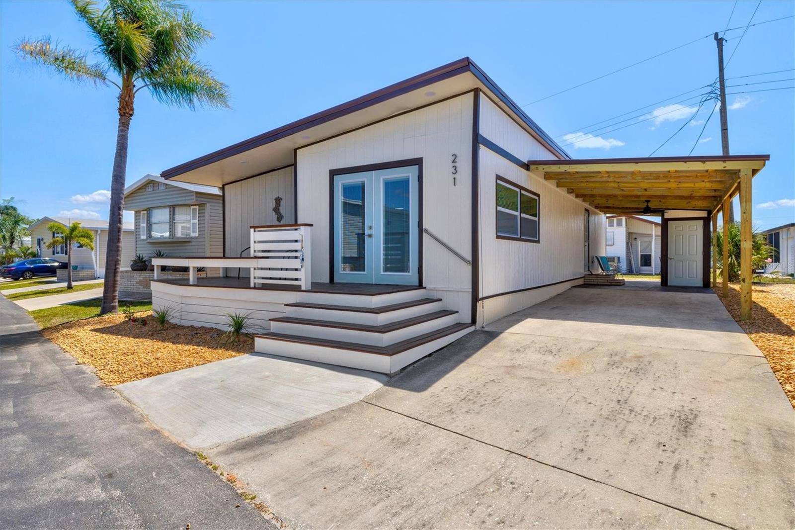 **** JUST REDUCED $15,000!!**** Step into this charming, FULLY FURNISHED 2-bedroom, 2-bath manufactured home with all new furniture, just minutes away from the famous SIESTA KEY BEACH in sunny Sarasota, Florida! Located in the highly sought-after Southwinds 55+ CO-OP community, this TURNKEY beauty has been completely updated and is ready for you to move right in and start enjoying the Florida lifestyle, with NO LOT RENT! From the moment you walk in, you'll notice the spacious and bright feel of this home, with two spacious bedrooms, with the master bedroom featuring a WALK-IN CLOSET. Both bathrooms have been beautifully remodeled in 2025, giving them a fresh, modern vibe. The brand-new kitchen (also redone in 2025) is a showstopper, complete with sleek QUARTZ COUNTERTOPS and shiny NEW STAINLESS STEEL APPLIANCES, making it the perfect place to whip up your favorite meals or entertain guests. The NEW VINYL PLANK FLOORING throughout adds a modern touch that ties everything together perfectly. This home has had all the heavy lifting done for you! With completely NEW PLUMBING and ELECTRICAL (2025), you can rest easy knowing everything is up to current standards. The HVAC system, which was installed in 2018, has been reinspected and is still in excellent condition, keeping you cool during those hot Florida days. Plus, a NEW-METAL ROOF and ALL NEW EXTERIOR SIDING are ready to stand up to whatever the weather throws your way, and the updated HURRICANE IMPACT DOORS AND WINDOWS add extra peace of mind. The NEW WATER HEATER (2025) adds even more efficiency to the home. Need some space for your laundry? No problem! The spacious laundry room located inside of the home has WASHER AND DRYER INCLUDED. There’s also a BRAND NEW CARPORT with a metal roof for sheltered parking and a NEW FRONT DECK that’s perfect for relaxing outdoors with your morning coffee. Plus, there’s a NEW STORAGE SHED for all your beach and outdoor gear. Oh, and did we mention this home is in an X FLOOD ZONE? No flood or water damage from recent storms – just peace of mind. Living in Southwinds means you’re part of an active, friendly community with fantastic amenities like a heated community pool, shuffleboard courts, horseshoe pits, a library, and a recreation hall. There’s guest parking and designated spots for RVs and boats, so you can make the most of your time in Sarasota, all for the LOW MONTHLY HOA fee of only $195! This move-in-ready gem is calling your name – don’t miss the chance to make it yours and start enjoying the best of Florida living today!