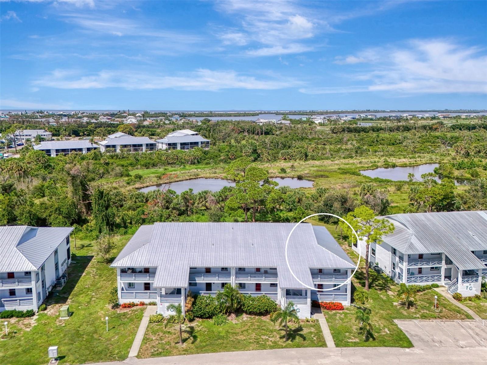 If you are looking for a spectacular condo at an unbeatable price, make your appointment today. This 2 bedroom, 2 bath, second floor end unit is located in the popular community of Fiddlers Green II, and since Hurricane Ian, has been completely remodeled from bottom to top. Upgrades, including new electric, new plumbing, and new roof, have been made, conforming to the most recent standards. The AC was replaced in 2019, and is serviced regularly. The condo also features new shaker kitchen cabinets, quartz countertops, all new luxury vinyl flooring in the kitchen, dining, and living rooms, new carpeting in the bedrooms, plantation shutters, new ceiling fans, new hot water heater, and brand new furniture. It is beautifully decorated and is being offered completely turn-key, except for a few personal items. This bright and airy unit has vaulted ceilings, an open floor plan and walk-in closets in each of the bedrooms. Sliding glass doors lead from the living room and primary bedroom to the spacious tiled lanai overlooking Wildflower Preserve. This unit also comes with a highly-coveted deeded covered carport, and as icing on the cake—the sellers are offering to convey, with a full price contract, a 2004 Saab convertible with under 80,000 miles and its high-quality car cover!!! Fiddlers Green II is a very friendly community with many amenities, including a community pool, tennis and shuffle board courts, BBQ areas, a community center, and activities galore. You are conveniently located to great restaurants, shopping, golf courses, beautiful beaches and excellent boating and fishing. Grab your piece of the Florida sun; make your appointment today.