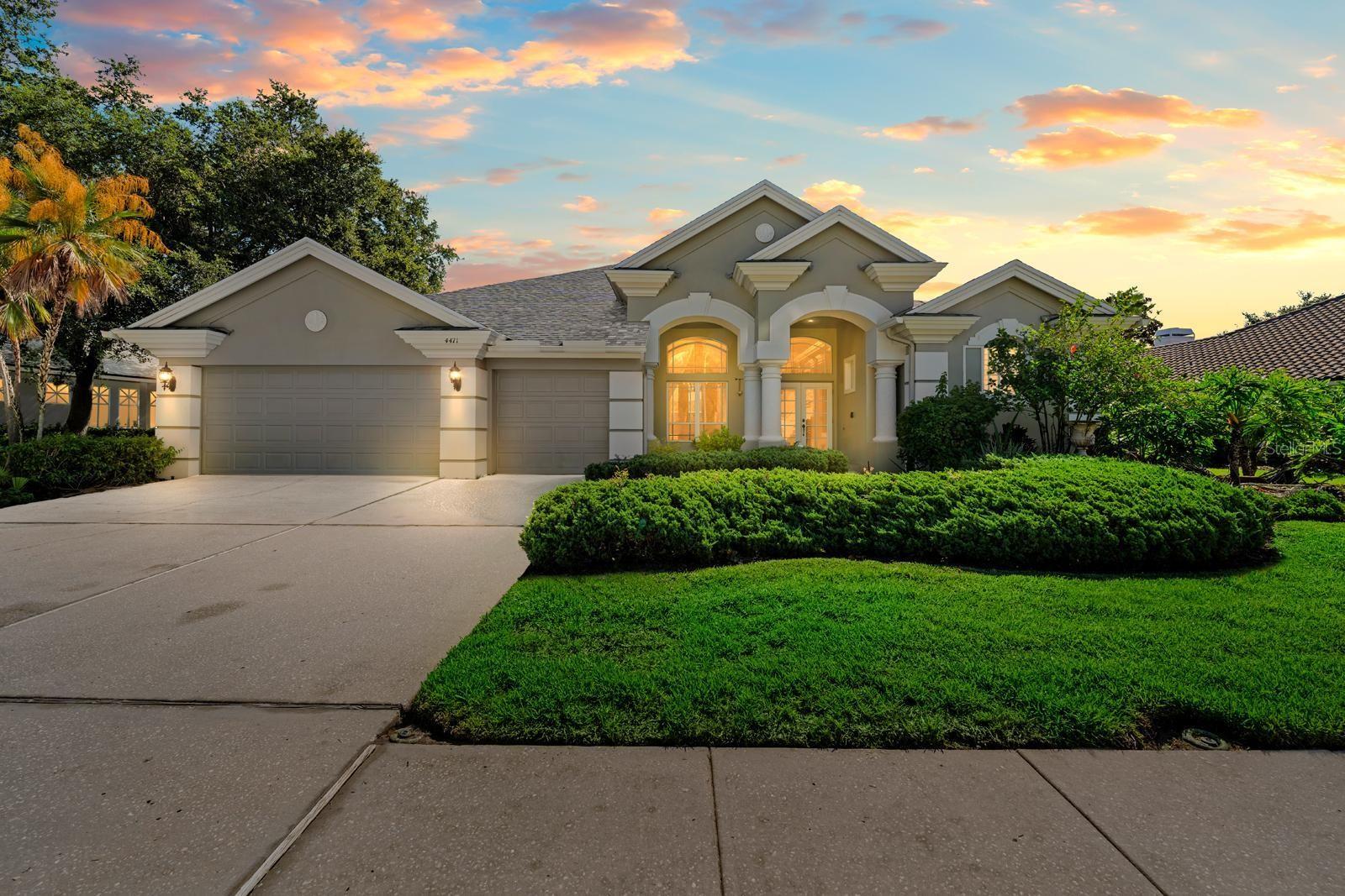 One or more photo(s) has been virtually staged. Welcome to Your Dream Home in the highly sought-after Lansbrook Community! Tucked away in one of the most desirable neighborhoods in Pinellas County, this exquisite Marc Ruthenberg-built residence features a beautifully maintained 4-bedroom, 3-bathroom and a rare 3-car garage. As you approach, a canopy of mature oak trees creates a picturesque entrance into the community—offering a sense of peace and prestige from the moment you arrive. Step inside to an open floor plan with soaring ceilings, abundant natural light, and luxurious touches throughout. Custom crown molding, plantation shutters, and recessed lighting elevate every corner of the home. The double-sided wood-burning fireplace adds a warm, welcoming ambiance between the living and family rooms. The heart of the home is the chef’s kitchen, featuring stainless steel Whirlpool appliances, including a double oven and built-in microwave (both under a year old), granite countertops, solid wood 42-inch cabinets, and a layout designed for both functionality and style. Unwind in the tranquil primary suite, where you’ll find a designer coffered ceiling, oversized walk-in closet, and a luxurious en-suite bath complete with dual vanities, soaking tub, and a separate shower. Step outside to your own private oasis: a screened-in pool and spa with a spillover waterfall, surrounded by a fully fenced backyard, perfect for gatherings or simply relaxing in serene surroundings.
Additional features include a 3-car garage and a roof replaced in 2021. Located outside of a flood zone, residents of Lansbrook enjoy access to two private parks. Lansbrook Commons offers walking trails, playgrounds, volleyball, tennis, pickleball, basketball, and soccer fields. At Lansbrook Lakefront Park, you’ll find a private boat ramp, fishing dock, picnic areas, and scenic water views.
All of this—just minutes from the Pinellas Trail, John Chesnut Park, Fred Howard Park, upscale shopping, dining, and top-rated East Lake High School and East Lake Middle School Academy of Engineering. Schedule your private showing today