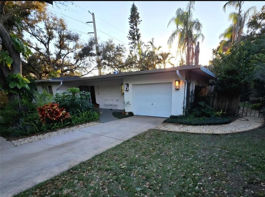 Discover this charming fully furnished,  turn key 3 bedroom/2 bath home located in Sarasota. 10-15 minutes to Siesta Key Beach, close to shopping, city and entertainment.  This home is surrounded by beautiful mature gardens and has a spacious layout with abundant natural light.  Inside you'll find a modern kitchen with updated appliances, inviting living spaces, a garage with laundry and sauna and a private backyard great for relaxation in a screened in lanai garden room. The home is being sold with high end furnishings, home decor, linens, dishes, etc.  The neighborhood is safe and is walking distance to a highly desired A rated school. Don't miss the opportunity to explore this delightful home and come see it for yourself.