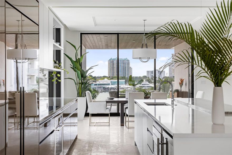 Brand-new, custom-built, and move-in ready, this full-floor condominium residence at En Pointe offers a rare blend of privacy, design, and elevated coastal living on Golden Gate Point. Set within a limited four-residence boutique condominium between the Ringling Bridge and downtown Sarasota, it delivers all the qualities of custom-home living with the ease and convenience of a lock-and-leave lifestyle. The residence captures views of Sarasota Bay, the marina, the downtown skyline, and the Ringling Bridge. Inside, the residence offers 2,439 square feet with 3 bedrooms and 3.5 bathrooms, plus two private covered terraces of approximately 350 square feet each—adding 700 square feet of exceptional outdoor living space. Designed as true extensions of the residence, the terraces easily accommodate open-air dining, a grill, and a generous lounge setting with TV hookup, creating an effortless indoor-outdoor lifestyle. Conceived in a neo-modern style by Echt Architects, the residence pairs refined craftsmanship with clean architectural lines and exceptional livability. A secured elevator opens directly into your private foyer, where walls of glass, expansive living spaces, and a chef-inspired kitchen create a residence that feels both sophisticated and welcoming. Spend evenings on the west terrace beneath the glow of the sunset, and begin the day on the east terrace with morning light over the marina—an elegant daily rhythm that feels distinctly Sarasota. The primary suite is spacious and serene, featuring a large walk-in closet, dual vanities, a soaking tub, an oversized shower, and direct access to the sunset terrace. Two additional en-suite bedrooms provide comfort and privacy for guests. Amenities at En Pointe include a heated saltwater pool, elevated decks for lounging and dining, two covered parking spaces, an EV charger, and ground-level bike storage. Just minutes to Main Street, St. Armands Circle, and Lido Beach, this is an exceptional opportunity to own a brand-new architectural condominium residence in one of downtown Sarasota’s most desirable settings.
