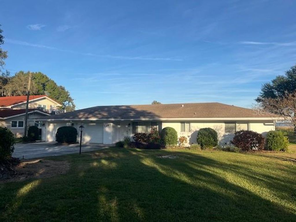 Photo of 1240 W Lake Hamilton Drive, Winter Haven, FL 33881 (MLS # P4937188)