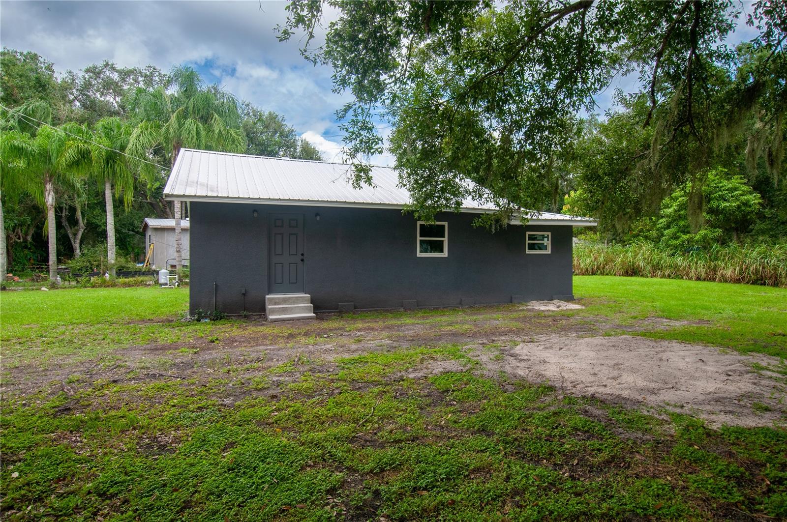 Move-in ready and beautifully updated! This 2 bedroom, 2 bath home sits on a 0.14± acre lot in the county and has been completely remodeled inside with modern finishes throughout. A brand-new roof and new AC unit provide peace of mind and efficiency for years to come. The thoughtful updates make this home feel fresh, inviting, and low-maintenance. An added bonus—the adjacent 0.29± acre lot is also available and currently listed on the MLS, offering a unique opportunity to expand your space or create an investment package.
