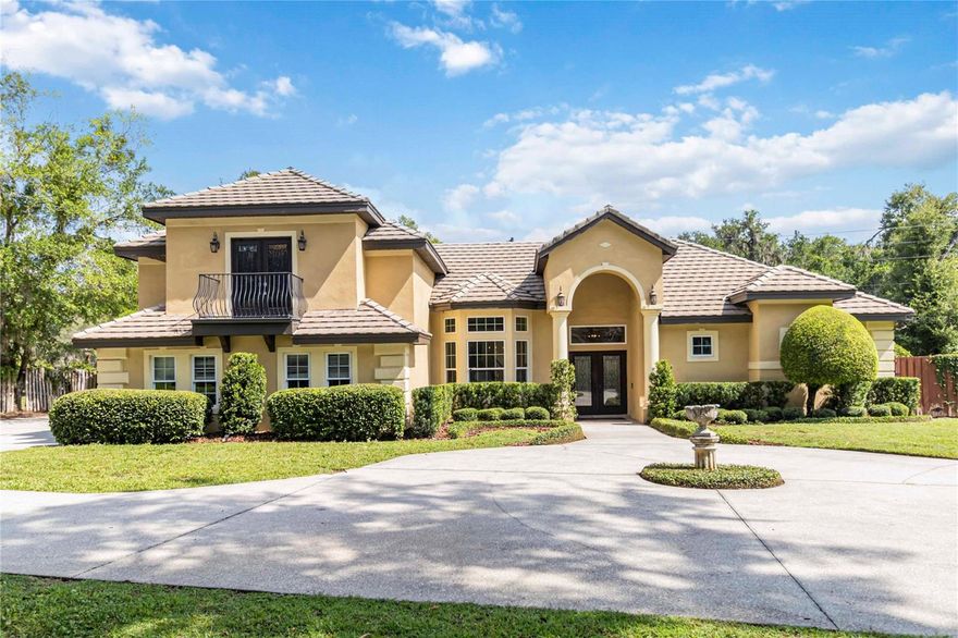 Welcome to Hamilton Place at Sweetwater Country Club — a distinguished golf course community offering lake access to beautiful Lake Brantley. This exquisite custom-built Mediterranean-style residence combines timeless architecture, elegant design, and modern luxury in one of Central Florida’s most desirable neighborhoods.
Boasting 5 bedrooms, 4 full bathrooms, and over 3,400 square feet, this home is thoughtfully designed for comfort and style, with all but one bedroom conveniently located on the main level. The exterior’s graceful arches, tile roof, and manicured landscaping set the tone for the sophistication found within.
Step inside to a light-filled interior where 10-foot ceilings, crown molding, and rich Acacia wood and tile flooring create a warm and inviting ambiance. Formal living and dining rooms provide refined entertaining spaces, while the spacious family room offers a stacked-stone fireplace and French doors leading to the lanai — blending indoor and outdoor living seamlessly.
The gourmet kitchen is a chef’s delight, featuring 42-inch cabinetry, granite countertops, stainless steel appliances, a large island, breakfast bar, and a casual eat-in nook overlooking the family room. Whether hosting gatherings or enjoying quiet mornings, this space is designed for both functionality and beauty.
The luxurious master suite is a private retreat with direct access to the lanai and pool area. The spa-inspired bath showcases a Jacuzzi tub, separate walk-in shower, dual sinks, and a custom California closet. A second master suite provides flexibility for guests or multi-generational living.
Upstairs, a stunning circular staircase leads to the fifth bedroom — a versatile space ideal for a guest suite, media room, playroom, or executive office — complete with a private balcony, full bath, and its own A/C system.
Enjoy breathtaking views of the pool and outdoor living area from nearly every room. The expansive lanai and recreation space are perfect for entertaining, featuring a sparkling pool and spa, summer kitchen, outdoor fireplace, and open patio with play area. The privacy-fenced yard and surrounding greenery create a serene, secluded setting with no neighbors on three sides.
Additional highlights include a three-car side-entry garage, ample extra parking, a workshop/shed for storage, and a cul-de-sac location offering peace and safety.
This exceptional property combines the grace of Mediterranean design with modern luxury and the resort-style amenities of the Sweetwater Country Club lifestyle — including golf, tennis, and private access to Lake Brantley for boating and recreation.
Experience elegance, comfort, and privacy in one of Apopka’s premier communities — welcome home to Hamilton Place at Sweetwater Country Club.
