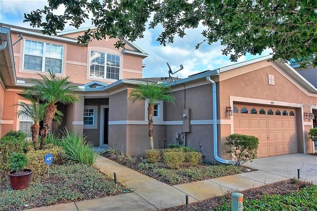 Beautiful Lake Mary town home with 2 car garage in gated community with a resort style pool, club house & playground, close to major highways and roads and conveniently located to Seminole State College, shopping and dining. This very popular floor plan has a large master suite downstairs, complete with a large walk-in closet, bath with garden tub and glass enclosed shower stall as well as double marble sink vanities. The stunning kitchen overlooks the open family room and features new stainless steel appliances, granite counter tops, a
tiled back-splash and 42" real wood cabinets. All main living areas have elegant ceramic tile that is easy to keep clean while the other rooms feature new carpets. The sliding door in the family room opens up to an open patio with serene water views. You will certainly enjoy this private backyard setting ! Every room offers light fixtures and ceiling fans . Zoned for Lake Mary High School! Don't wait too long, this home is ready today