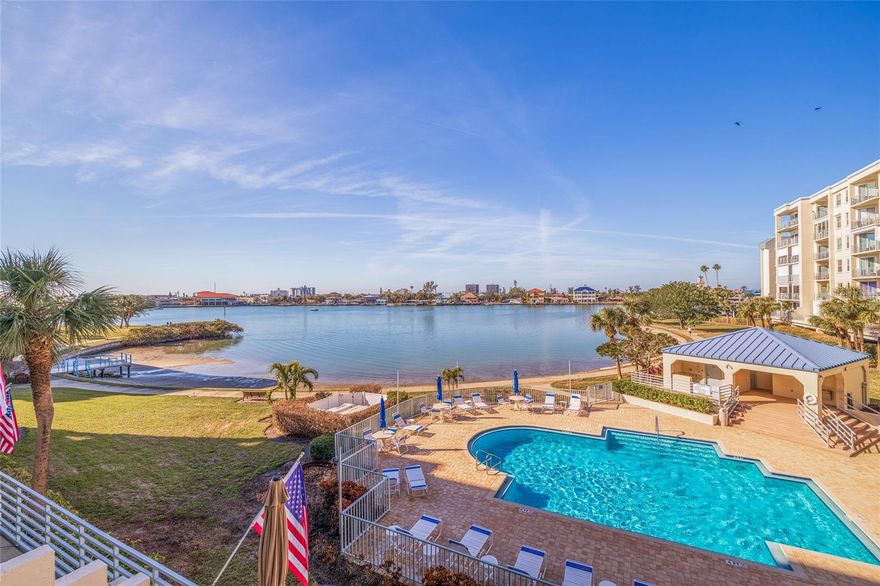 Imagine watching breathtaking sunsets from your private, west-facing balcony after a lively afternoon of pickleball - all within Harbourside, one of Pasadena's most amenity-rich, 24/7 gated waterfront communities. This beautifully remodeled 2-bedroom, 2-bath condo is ideally located on the second floor of an east/west-facing building, welcoming in abundant natural light and refreshing coastal breezes with picturesque sunsets. The open-concept layout showcases elegant crown molding, 5-inch baseboards, and a thoughtfully upgraded kitchen featuring granite countertops, stainless steel appliances, custom cabinetry, and convenient in-unit laundry. The spacious primary suite offers serene water views, a walk-in closet with custom built-ins, and a fully renovated en-suite bath, while the generously sized second bedroom and updated guest bath provide flexibility for visitors, a home office, or den. Recent upgrades include a complete transformation of the interior (the photos speak for themselves!), new HVAC system (2023), roof replacement (2024), all-new outlets and switches, and a whole-condo surge protector for added peace of mind. Harbourside's resort-style amenities are second to none, with a heated waterfront pools (5 in total), tennis and PICKLEBALL courts (no waiting here!), shuffleboard, two fitness centers with saunas, a 1.75-mile waterfront walking path, a marina with available slips, EV charging stations, a car wash area, and an active clubhouse hosting regular social events. With assigned covered parking, extra storage, and a prime location just minutes from St. Pete Beach, top dining, shopping, and the vibrant energy of downtown St. Petersburg, this move-in-ready condo offers the perfect blend of comfort, convenience, and coastal living - ideal as a full-time residence, seasonal retreat, or savvy investment. 3- month minimum rentals allows for a great staycation & opportunity for passive income when you're away! Don’t miss the chance to own your slice of paradise on Florida’s Gulf Coast!