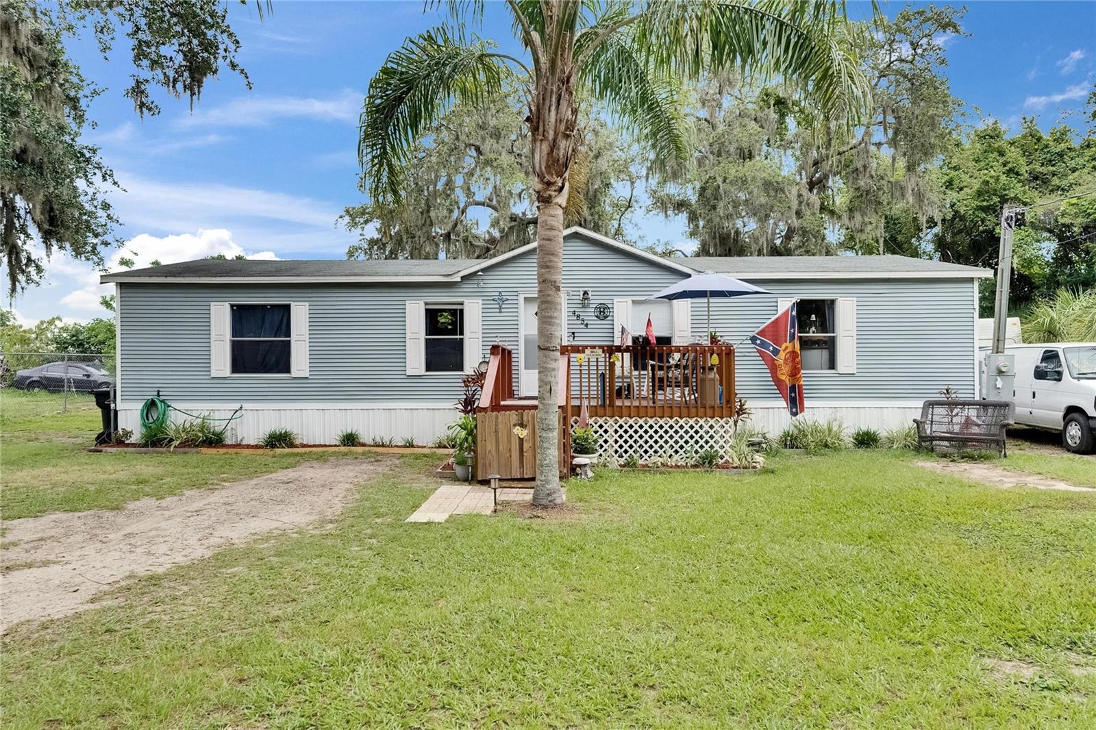 Welcome to your new, move-in ready, home! This lovely 3 bed/2 bath home sits on .26 acre with NO CDD and very low HOA!!! You can park your BOAT, RV, TRAILERS, and toys here offering convenience and savings on monthly storage fees! The home features Newer Roof (2022), Newer A/C (2022) New Paint (2022), New Floors (2022), updated lighting, fully remodeled primary bathroom (2024), and Newer Skirting. Easily finish the partial wood fencing to enclose for your pets and store your yard equipment in the storage shed sellers are leaving. Conveniently located close to State Road 60, Restaurants, Shops, Polk State College Lakeland 25 Minute or Hillsborough Community College 20 mins, and more. Enjoy life how you want to live it in this spacious and well-maintained home. Schedule your showing today!