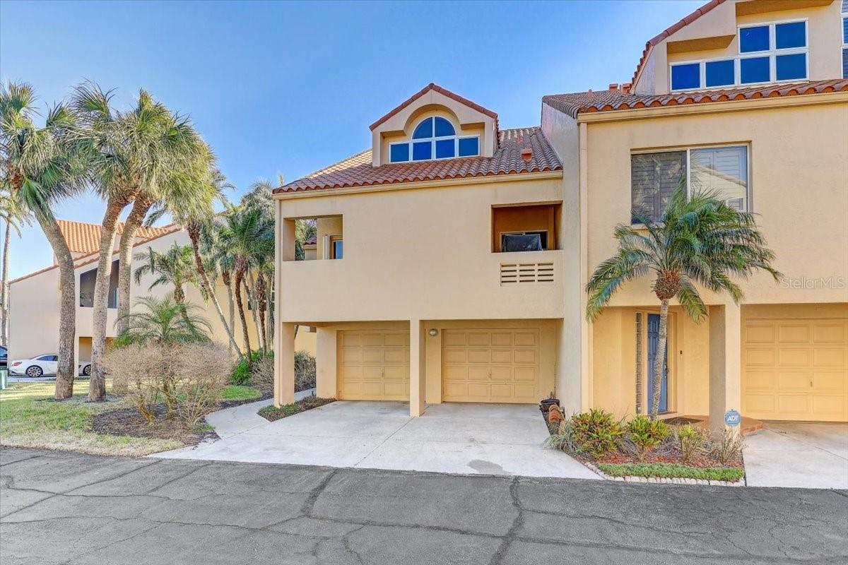 Discover Your Dream Oasis! Step into this exceptional multi-level waterfront townhome, offering the perfect blend of space and serenity. Nestled in a small, gated enclave of only 19 townhouses, this home offers a sense of community and tranquility. With 2 to 3 bedrooms and 3 bathrooms, this gem is designed for both relaxation and entertainment.The flexible layout includes two dining areas, one of which can seamlessly transform back into a third bedroom with an en suite bathroom and private balcony.
Bask in the beauty of lush tropical landscaping and breathtaking vistas of the golf course, creek, and Boca Ciega Bay right from your window.An expansive open kitchen awaits your culinary creations, complemented by a striking stone fireplace that adds warmth and charm. The vaulted ceilings create an airy atmosphere, while abundant storage ensures everything has its place.
Enjoy the convenience of a two-car garage and two additional driveway spaces, perfect for family and guests.
Dive into leisure with a nearby swimming pool and cozy mini fire pit. Fishing enthusiasts will appreciate easy access to the mini bridge over the Bay or the creek right outside your back door.
Just a short drive away, the quaint downtown of Gulfport awaits, along with a Publix supermarket for all your shopping needs. Plus, boat dockage is less than 5 minutes away!
Don’t miss out on this rare opportunity—your tropical paradise awaits!