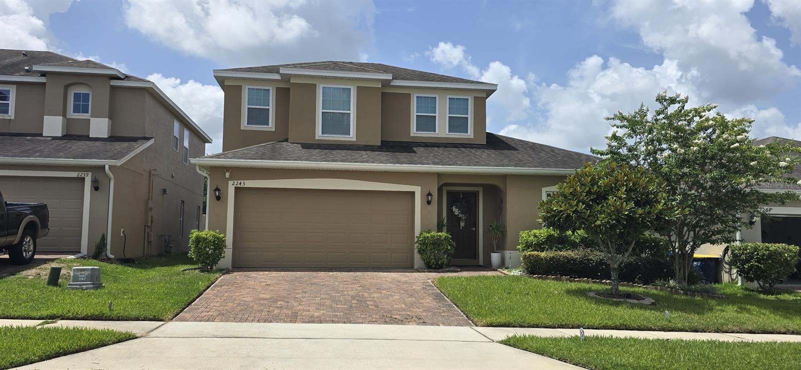 This beautiful residence located at 2243 Napone Lane, Minneola, FL 34715 offers 4 bedrooms (including 2 master suites with private bathrooms), 3 full bathrooms, a formal living and dining room, family room, loft, kitchen with gas stove, fully equipped laundry area, screened-in covered patio, fenced backyard, and parking for 4 vehicles (2 covered and 2 in the driveway), all within 2,483 sqft of living space. Situated in a peaceful, family-friendly community with a resort-style pool and playground, this home is ideal for those prioritizing education and their family's safety. It is conveniently close to highly rated schools such as Minneola Charter School (K-8), Grassy Lake Elementary, and Lake Minneola High School, all within walking or biking distance. The home also enjoys an excellent location within the community, offering open views perfect for enjoying beautiful sunsets in a healthy and relaxed environment. The property has easy access to the Turnpike and major roads such as Highway 50 and US-27, providing great connectivity to nearby cities, and is just minutes from supermarkets, stores, pharmacies, and everyday conveniences.