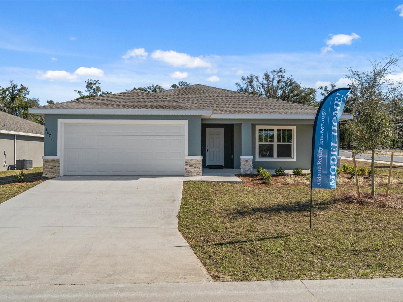 One or more photo(s) has been virtually staged. Beautiful new construction home! MOVE-IN READY!! Brand new everything, ready for you to make this house a home. Luxury Plank Vinyl flooring throughout all living and common areas, tile in bathrooms, and carpet in the bedrooms. Open floor plan, cathedral ceilings, dedicated dining room, walk in pantry, and large kitchen island area, all done in neutral, pleasing colors. Inside laundry with W & D hook-ups. Walk-in closet in Master bedroom and double vanity sinks in master bath. Stainless steel appliance package in the kitchen. This home will have shaker-style cabinets and light luxury granite countertops. Dining room overlooks lanai. Pictures are of another home, same model. Home will have stacked stone on exterior. Please see attached documents from Builder (Builders Contract Addendum & Warranty) Actual photos are currently unavailable. Any photos depicted are for illustration purposes only and only to show layout. Floor plan displayed is our standard plan and garage orientation may vary on actual home. Interior and exterior colors, finishes, and garage orientation will vary for actual home. Information is deemed correct, but no guarantee made. Any dimensions listed are approximate.