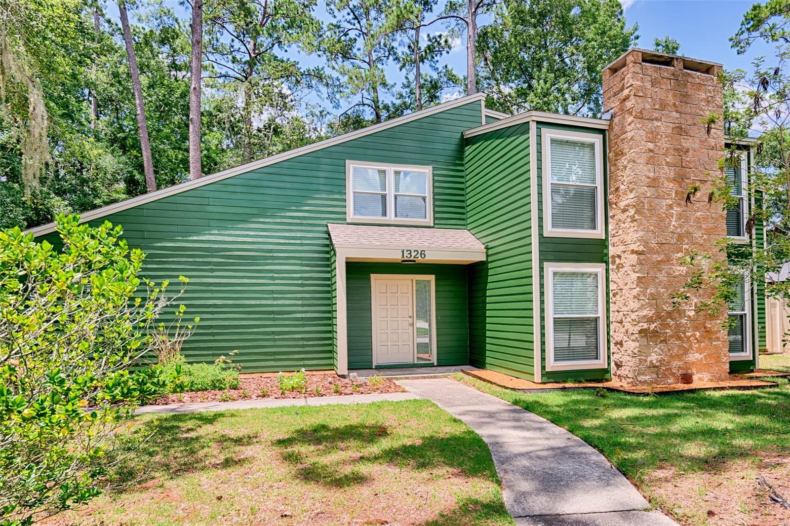 One or more photo(s) has been virtually staged. Wow! Wow! Wow! Welcome to this beautifully updated and spacious home in the Kingswood neighborhood—right in the heart of Gainesville! This 4-bedroom, 2.5-bath home offers 2,472 square feet of living space. Step inside to a bright main living area with a wood-burning fireplace. The dining room flows into a large kitchen featuring granite countertops, plenty of cabinetry, and a closet pantry—perfect for storage. Just beyond the kitchen, a versatile room that could be an office or private study. Luxury vinyl plank flooring runs throughout the home. Upstairs, you’ll find four generously sized bedrooms and updated bathrooms with granite countertops. The owner's suite features a walk-in closet and a spacious en-suite with a walk-in shower. A bonus room with its own closet provides flexible space for a 5th bedroom, den, or playroom. Additional highlights include a hobby/storage room off the kitchen with backyard access, a screened-in porch and an attached two-car garage. The fully fenced backyard offers a gazebo and storage shed. New energy-efficient double-pane windows, new siding and exterior paint, a brand-new roof, and a new water heater. This move-in ready home is located just 4 miles from UF/Shands and only 1 mile from NFRMC. Near the Shoppes at Thornbrook shopping, Publix, local restaurants.