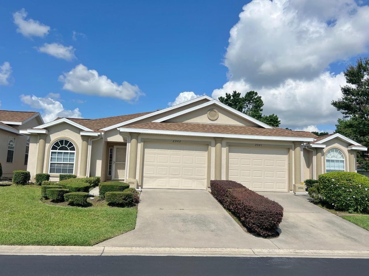 Welcome to this beautifully maintained and move-in-ready condo, ideally located in the heart of Ocala. This charming residence at 2342 SE 18th Circle offers the perfect blend of comfort, style, and convenience. Step inside and immediately feel at home in the light and airy living space, enhanced by soaring cathedral ceilings and two skylights that flood the interior with natural light. The open-concept layout creates a spacious and inviting atmosphere, ideal for both everyday living and entertaining guests.
The kitchen is both functional and attractive, featuring light wood cabinetry, beveled edge countertops, a generous pantry, and a laundry area equipped with a washer and dryer. Tile flooring extends throughout the kitchen, dining area, hallways, foyer, and bathrooms, offering durability and easy maintenance.
Enjoy quiet mornings or relaxing evenings on your covered lanai, the perfect place to unwind and take in the peaceful surroundings.
The primary bedroom suite is a true retreat, boasting a large walk-in closet and an en-suite bath with a garden tub, separate walk-in shower, and double vanities for added comfort and convenience. This home has everything you need. Located close to shopping, dining, and medical facilities, you'll enjoy the best of Ocala living. Don’t miss your chance to own this stunning condo—schedule your private tour today!
