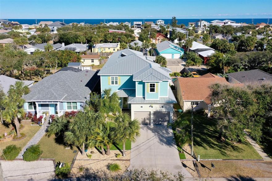 Luxury Coastal Living Awaits at 2035 S. Flagler Avenue - 
ONLY 3 BLOCKS FROM THE BEACH! This custom-built Flagler Beach retreat blends coastal charm with top-tier construction and luxury finishes. Built to last, it features solid concrete block construction with double rebar, a commercial-grade metal roof, impact-rated windows/doors (175 mph), and electric window treatments.

Inside, enjoy an open-concept layout with 10’ ceilings, luxury vinyl plank flooring, and a cozy gas fireplace. The chef’s kitchen is a showstopper, with quartz countertops, custom cabinetry, and a decorative dual-fuel range.

The private backyard is a true oasis—featuring a 7-ft deep, solar-heated saltwater pool with waterfall, a full outdoor kitchen, and a 20/20 UV-blocking screen enclosure covering the entire yard. Low-maintenance landscaping includes artificial turf, permanent mulch, drip irrigation, and a fenced yard with an electric gate and 30’ RV pad. A Generac 20kW generator and buried 250-gallon propane tank offer security and convenience.

An elevator connects to the second floor with a spacious flex room, theater room (110” screen, 7.1 surround), and a spa-inspired master suite. Two guest bedrooms provide ample space for family or visitors.

The oversized 4-car garage includes 8’ insulated doors, epoxy floors, 12’ ceilings, WiFi connectivity, and a Lorex 11-camera security system.

Prime location just steps from the ocean and Flagler Beach’s restaurants and shops. Coastal luxury, safety, and comfort in one impeccable package! Schedule your private showing today!