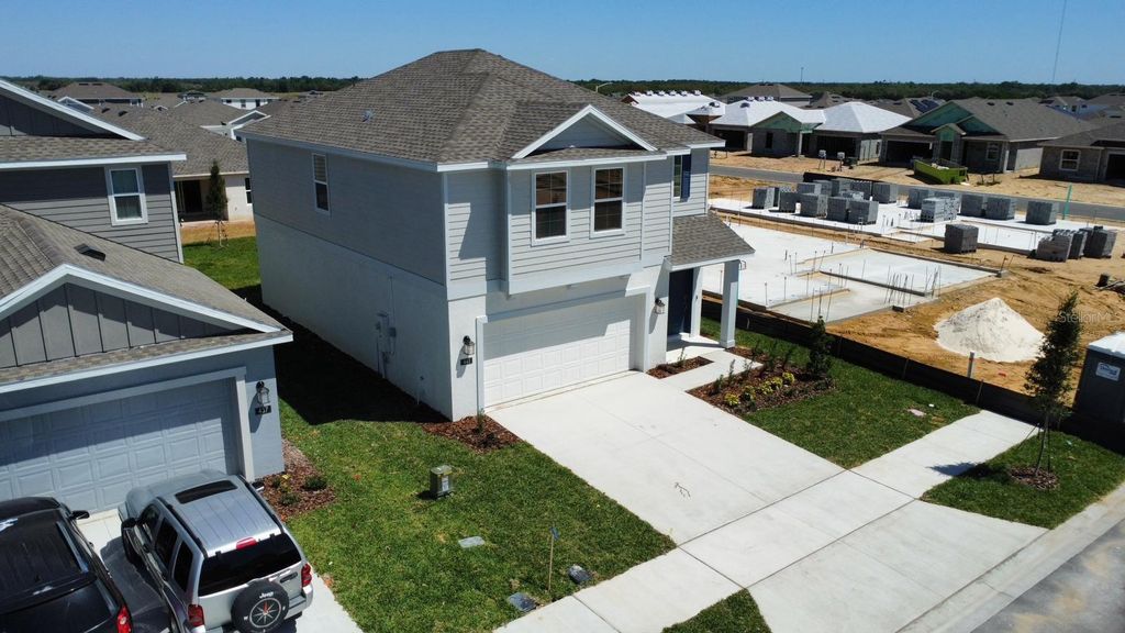 Photo of 441 Sandbar Lane, Haines City, FL 33844 (MLS # O6402050)