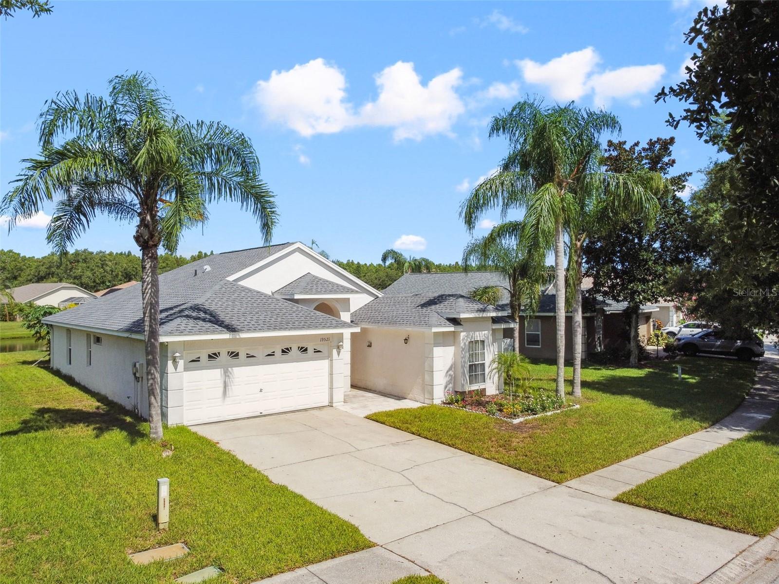 This charming 3-bedroom, 2-bath, 2-car garage home, located in the highly sought-after Steinbrenner High, Martinez Middle, and McKitrick Elementary school district, offers an open split floor plan with a spacious kitchen seamlessly flowing into the great room, filled with natural light from large windows. The master bedroom boasts his-and-her walk-in closets and a tranquil water view, while the serene backyard with a beautiful pond is perfect for relaxing or entertaining. Ideally situated near shopping, highways, golf courses, restaurants, medical facilities, and top-rated schools, this home has no CDD fees, a low HOA, and is in a no-flood zone. Recent updates include a 2021 roof, 2020 patio, 2025 stove and water softener, 2023 microwave, and other improvements like updated floors, fridge, washer, dishwasher, and screen door, ensuring peace of mind for years to come. Whether you're seeking your dream home or a great investment opportunity, this home truly has it all—schedule your showing today!