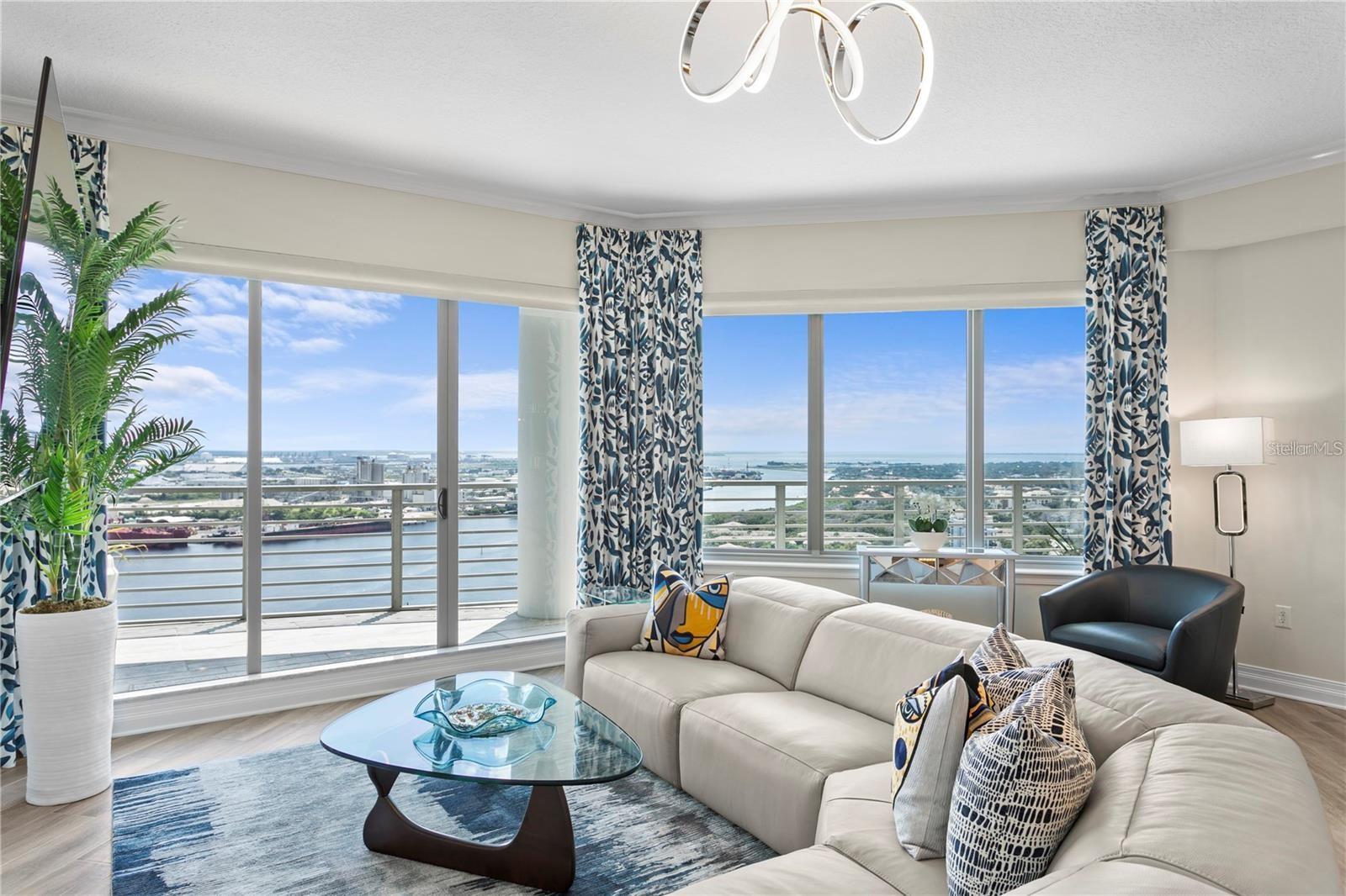This very large two-bedroom, two-and-a-half bath residence features a layout of two suites with a split floor plan.
Enter through the striking, large wood double door entrance and immediately see inspiring water views that can also be seen from every room through the large windows and sliding glass doors.
The expansive 225-square-foot wraparound terrace is fully covered and overlooks the Garrison Channel, Harbour Island, Sparkman Wharf, Giant Cruise Ships and The Florida Aquarium.
The newly remodeled designer kitchen opens to the living area offering matching stainless steel appliances, bar seating, a stylish Granite backsplash, New Bespoke Internet Computer Refrigerator, Granite Counters and built in Garbage Compactor. The master suite features a huge floor-to-ceiling window, balcony access, a built-out closet, granite dual vanity, deep soaking tub and oversized walk-in shower. Additionally, the second suite also features balcony access, a built-out closet, granite dual vanity, a second deep soaking tub and glass walk-in shower. Key features include beautiful wood grain tile flooring throughout the entire space, tray ceilings in the foyer and designer Kitchen, Sunshades with Custom Blinds on the sliding glass doors, Built in Fireplace with Porcelain Mantle, new water heater and washer and dryer. This unit also has two covered parking spaces on the same floor.
The Towers of Channelside amenities include a 24-hour concierge, two 5th-floor rooftop dog walk areas, resort-style pool with heated spa and rock waterfall, a large clubhouse for residents to use along with a grill station and on-site management. Located in the Channel District moments away from Amalie Arena, the Tampa Riverwalk, Sparkman Wharf, Harbour Island and new Water Street District.
Turnkey for a minimum of 7 month stay. Owner will pay for internet, water and sewer, garbage and all costs including electric and HOA costs.