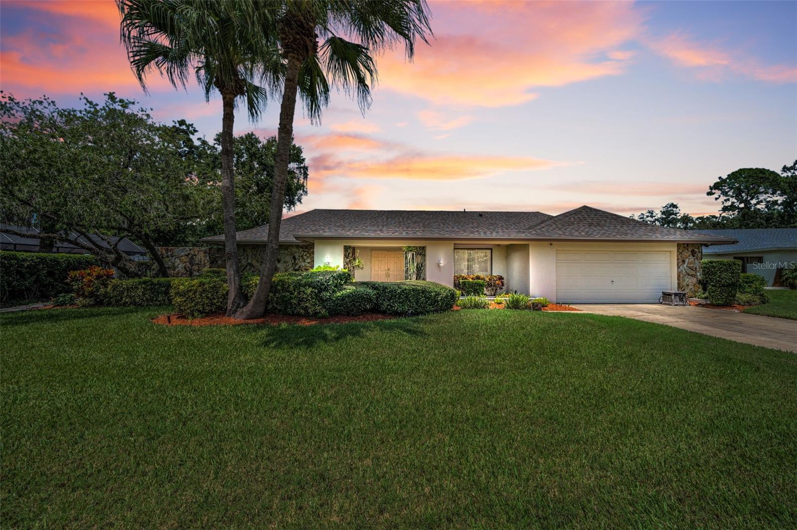 Discover the charm of Lake Ellen Woods, a hidden gem tucked inside the highly desirable Carrollwood community, where residents enjoy exclusive access to picturesque Lake Ellen. This inviting 4-bedroom pool home is perfectly set on a peaceful 1/3 acre cul-de-sac lot and immediately impresses with its curb appeal and NEW dimensional shingle ROOF (December 2024). Step through the double-door entry into elegant formal living and dining spaces, ideal for entertaining. At the heart of the home, a spacious kitchen with built-in wet bar flows seamlessly into the family room—complete with a tranquil built-in fish tank that brings serenity to the space. The smart three-way split bedroom plan ensures privacy for all, while the primary suite offers a true retreat with dual walk-in closets and a private ensuite bath. A secondary bedroom at the back of the home includes its own full bath that doubles as a convenient pool bath. Step outside and you’ll find a large pool with NEW SCREEN ENCLOSURE and outdoor wet bar—perfect for weekends spent relaxing or entertaining friends and family. The fenced yard offers plenty of space for play or pets. All this and just minutes from local dining, convenient shopping and endless activities. Best of all, while the home is ready to enjoy right away with all major 4-point components completed (HVAC, 2022), it also offers the opportunity for you to add your personal touches and make it truly your own. Call to schedule your private showing today!