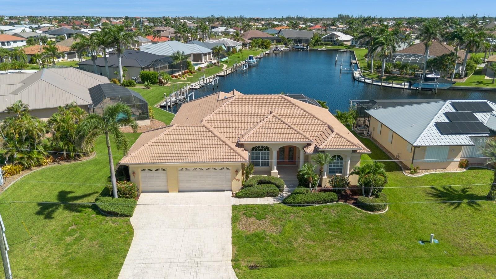 Nestled in the highly sought-after boating community of Punta Gorda Isles, this beautiful light and bright 3 car garage, pool (with a spa) home features an impressive and rare long view of a sailboat canal (no bridges to Charlotte Harbor) providing access to the Harbor through Buckley Pass and the ability to sail anywhere from your backyard. The expansive 2,416 Square feet includes 3-bedrooms and 2-bathrooms, a very large kitchen with an island and a separate breakfast nook overlooking the very private lanai, a large laundry room, a separate living room and family room each with beautiful sliding doors offering views of the pool and spa and the 72 feet of waterfrontage beyond. Equipped with a 3 car garage and many oversized closets, this home will support all of your hobbies and hold all your toys! This is a true waterfront gem! This home also has (just shy of) 60 feet concrete dock with water and electric. The high ceilings, spacious layout, quiet cul-de-sac street, make this a must see home.
Located just minutes from historic downtown Punta Gorda, Fishermen’s Village, and top-rated waterfront dining, you can enjoy all that the Punta Gorda has to offer including the weekly Farmer's Market, festivals, shopping, the Pickleplex and traveling to and from by way of a very convenient Punta Gorda Airport.
This is more than a home—it’s the Florida waterfront lifestyle you’ve been waiting for. Schedule your showing today!