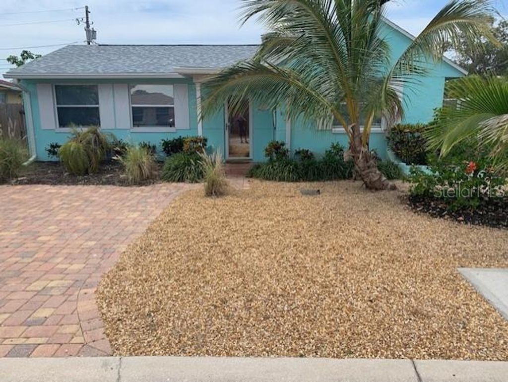 Photo of 411 Virginia Avenue, Madeira Beach, FL 33708 (MLS # TB8351115)