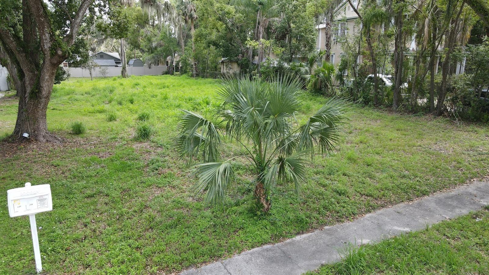 Cleared 0.29-acre lot with stamped duplex plans for two 3BR/2BA units (1,500 sq ft each) strategically positioned for college and healthcare commuters. Property is 0.5 mile from Beacon College and 0.9 mile from UF Health Hospital with direct trail access for safe walking and biking. Backs to Leesburg Trail providing car-free commuting to downtown Leesburg. Walking distance to Venetian Gardens, Leesburg Aquatic Center, Publix, and downtown restaurants. Utility upgrades paid for to the city for a duplex, building plans provided. Ideal for house hacking or investment property.