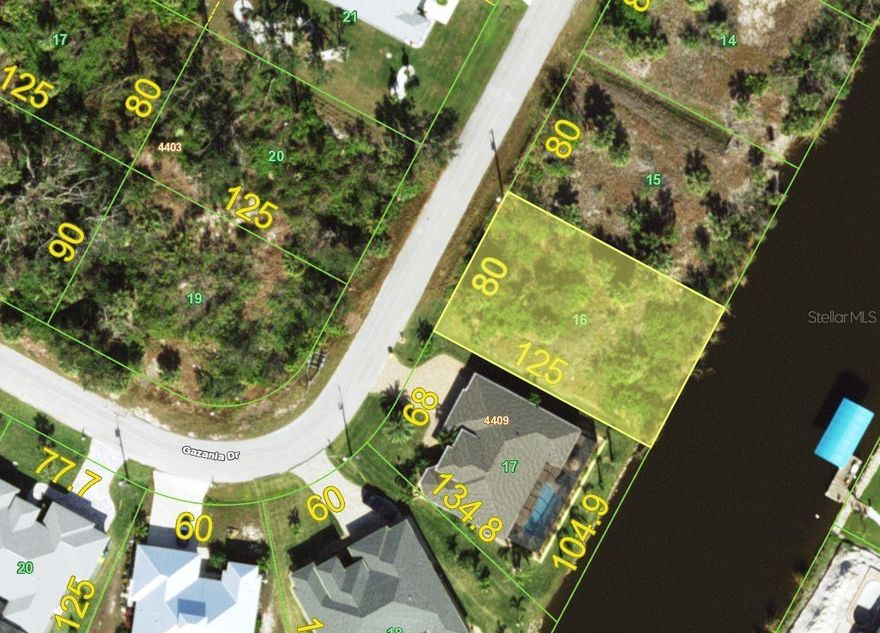 Great lot located in the much sought-after deed restricted South Gulf Cove neighborhood. This canal front residential building lot with 80' of waterfront is located on the Santa Cruz Waterway with one bridge and access through the Butterford Lock out to Charlotte Harbor and the Gulf. Standard lot is 10,000 square feet and is waiting for you to build your Florida dream home with pool. Access to public boat ramp or add your own to this property. Public water and sewer available and not in a Scrub Jay zone (check again with county website to ensure nothing has changed). The drive is minutes to Boca Grande & Englewood beaches, shopping, golf courses, great restaurants, Tampa Ray's Spring Training. New homes are thriving in the community and expected to continue.