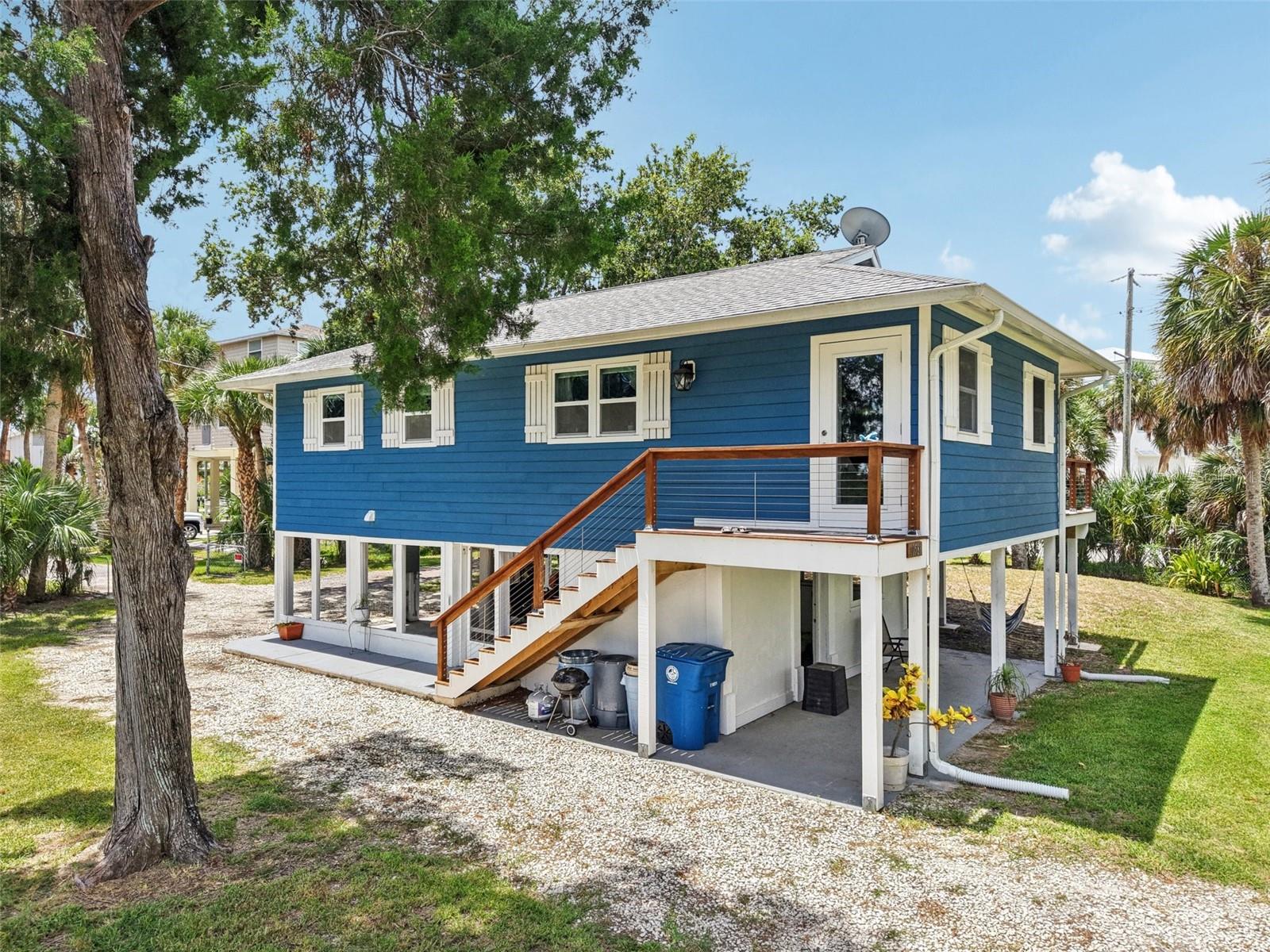 Your Pine Island Beach Retreat Awaits! This beautifully remodeled 2-bedroom, 1-bath home captures the essence of coastal living with stylish updates and Gulf views. Inside, the light and airy open layout features wood cabinets, granite countertops, stainless steel appliances, beachy-toned flooring, upgraded lighting, and chic coastal décor — all furniture included. Every major update is complete: impact windows and doors, upgraded insulation, new electrical throughout, new siding, AC, baseboards, and interior doors.
Step outside to a spacious wood deck with sweeping views of the Gulf of America, perfect for morning coffee or sunset cocktails. The large fenced yard offers privacy, space for outdoor entertaining, and room to store your kayaks (included!) and golf cart (included!) for cruising to the newly updated Pine Island Park — a 3-acre Gulf-front gem with a sandy beach, swimming area, crab hunting, and dolphin watching.
An optional HOA provides access to a private community dock and boat ramp with direct Gulf access, plus its own secluded beach. Here, you can enjoy laid-back island living while staying close to shopping, restaurants, hospitals, and the Veterans Expressway for easy travel. Pine island is 6 blocks long and 2 blocks wide and is connected to the mainland by two bridges. With only approximately 40 homes here, now is the chance to claim your slice of paradise! Bring your flip-flops and start living the Pine Island dream today!
