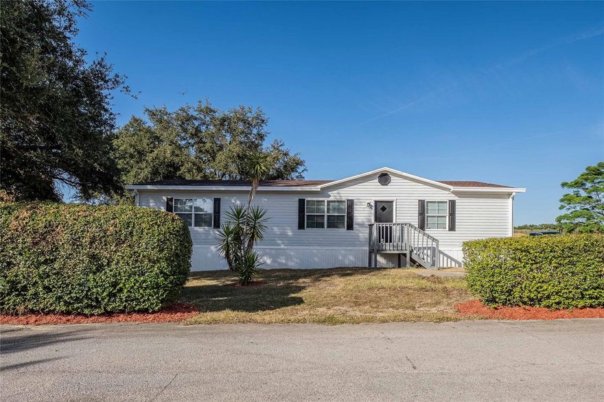 Beautifully updated 3 bed / 2 bath double-wide manufactured home (1,568 sq ft) priced UNDER $200K! **Seller finance available**
This 2006 home sits on a fenced 0.16-acre lot with no rear neighbors—just peaceful open land behind you.

Freshly painted inside and out, this move-in-ready property features:
Brand-new luxury vinyl plank flooring
Updated bathrooms with new vanities and countertops
Modern lighting throughout
Clean, refreshed kitchen with a propane range
Newer propane water heater (May 2023)
Roof (2019) and HVAC (2018) for major system peace of mind

The split floor plan provides excellent privacy, and the spacious living areas offer plenty of room for relaxing or entertaining. Located in a quiet, rural part of Lake Wales, yet close to shopping, restaurants, and everyday conveniences. NO HOA!

Move-in ready, updated, and priced to SELL at $199,900. Don’t miss this opportunity!

Seller Financing Available!
Seller may offer rate buydown or closing cost assistance with a strong offer. Assistance is negotiable and not guaranteed in a multiple-offer situation.

USDA eligible.