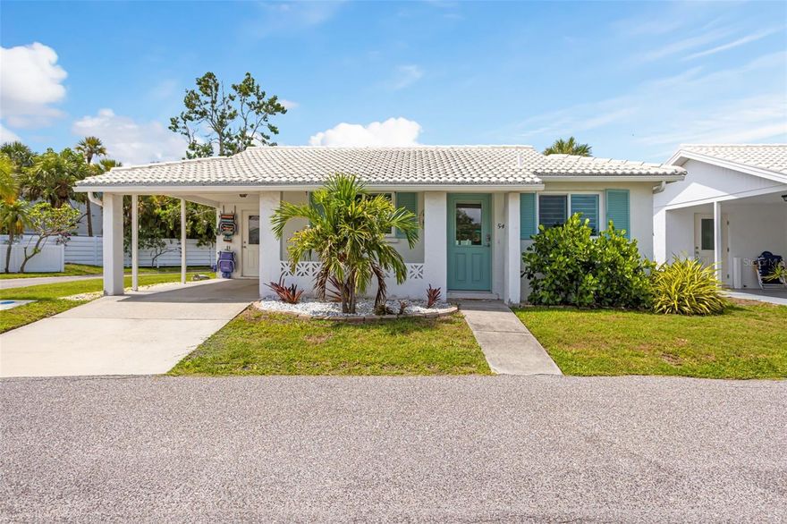 Tucked within the waterfront community of Spanish Main Yacht Club on the north end of Longboat Key, this fully renovated detached villa offers a timeless coastal flair just steps from the beach. A true hidden gem and slice of paradise, residents enjoy private deeded beach access to the Gulf of America, a deep water marina with affordable boat slips, and the ultimate boating lifestyle with easy access to waterfront restaurants and open waters. This light and bright 2-bedroom, 2-bath residence is being offered turnkey furnished. Featuring an open floorplan with luxury vinyl plank flooring, impact windows and doors, custom window shades throughout, and a spacious Florida room ideal for additional living or entertaining space. The beautifully updated kitchen showcases quartz countertops, stainless steel appliances, abundant custom cabinetry with soft-close drawers, and a large seating island perfect for gathering. Additional highlights include an interior laundry room with stackable washer and dryer, water softener system, stone paver patio, covered parking, and private driveway. Spanish Main Yacht Club is a vibrant and active 55+ community offering a heated waterfront pool, shuffleboard, social events, pet-friendly policies, maintenance-free living, and one of the most desirable 40-slip marinas on Longboat Key. Ideally located just minutes from St. Armands Circle, Sarasota, and Anna Maria Island, this exceptional Longboat Key retreat is ready for immediate enjoyment.