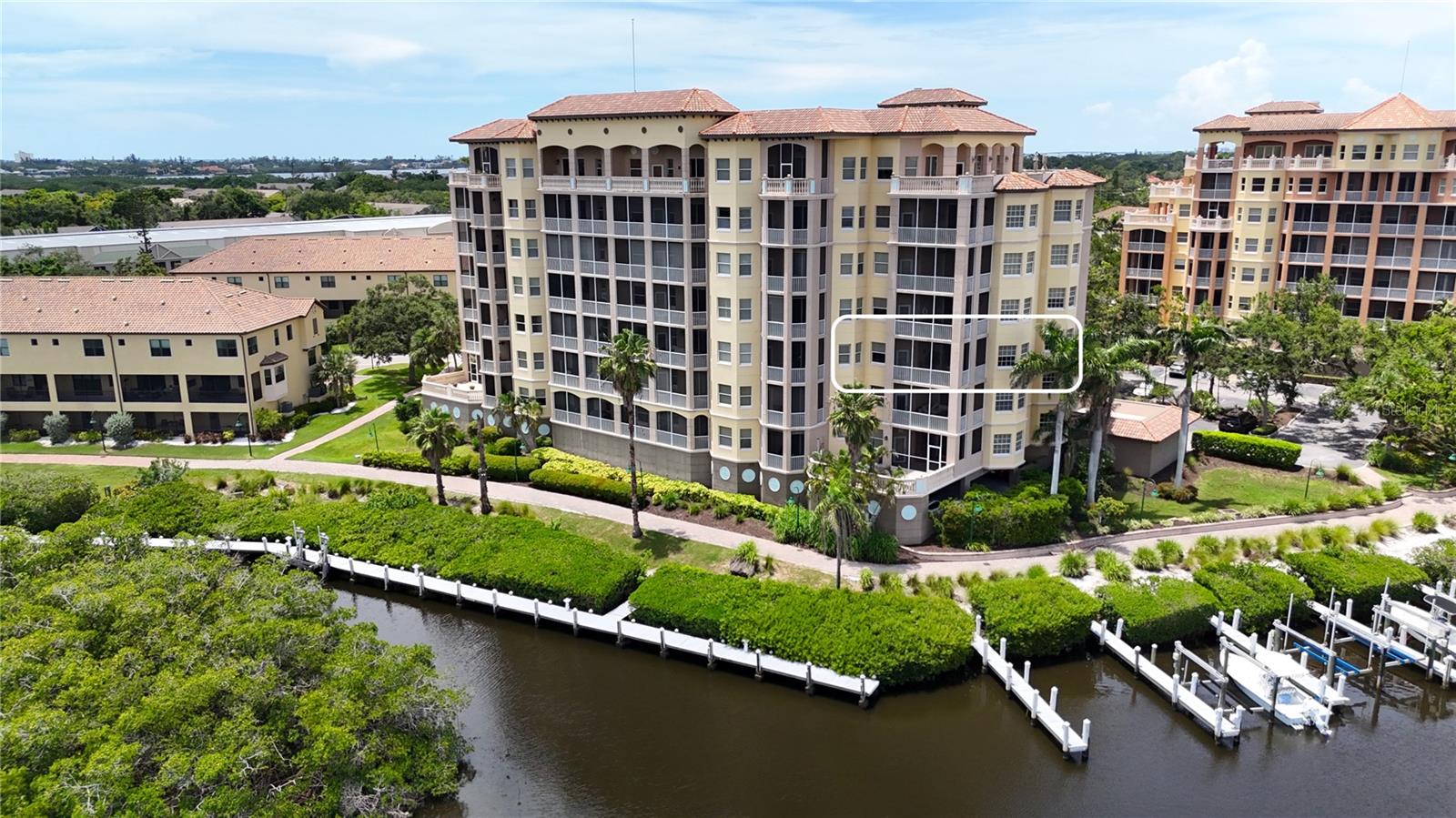 Welcome to 1921 Monte Carlo Drive, Unit 302—a beautifully remodeled third-floor luxury residence with water view in the gated waterfront community of Phillippi Landings, perfectly situated West of the Trail and just minutes to the world-renowned beaches of Siesta Key. Nestled along Phillippi Creek with direct access to Sarasota Bay, this elegant 2 bedroom plus den, 2 bath condo offers the ideal blend of privacy, convenience, and resort-style living. From the moment you enter via direct elevator access to your private foyer entrance, a feature rarely found in condominium living, you are welcomed by an open and airy floor plan, porcelain tile flooring throughout, and an inviting coastal aesthetic. The beautifully updated kitchen features granite countertops, stainless appliances, and rich wood cabinetry, offering both style and function for everyday living and entertaining. Step into the spacious living area that opens to a private covered and screened balcony with peaceful water view, ideal for enjoying morning coffee or a glass of wine at sunset. The split-bedroom layout offers exceptional privacy, with two generously sized bedroom suites. The primary suite is a true retreat, offering tranquil water view, two large walk-in closets, and a spa-style bath with a jetted soaking tub, custom walk-in shower, and private water closet. A flexible bonus space off the main living area provides the perfect nook for a home office, den, reading lounge, or secondary dining area. Impact doors and windows throughout. Enjoy the convenience of under-building assigned parking and a private storage unit. This home is move-in ready and ideal as a primary residence, seasonal escape, or investment opportunity. Life at Phillippi Landings is exceptional - the community is 10 acres and offers a resort-style heated pool and spa, a well-equipped fitness center, clubhouse, and an expansive waterfront promenade perfect for evening strolls beneath swaying palms. For boating and nature enthusiasts, the community provides kayak launch access and private storage racks—an invitation to explore the peaceful waterways of Phillippi Creek and beyond. The lush, manicured grounds and tropical landscaping create a tranquil, private atmosphere while placing you just minutes from The Landings Shopping Center, Southside Village, downtown Sarasota, and the vibrant shopping and dining of UTC Mall. This exceptional location, paired with a refined, low-maintenance lifestyle, offers the best of coastal Florida living—elegant, easy, and immersed in nature.