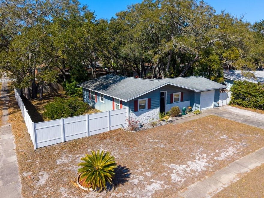 One or more photo(s) has been virtually staged. ONLY 1.6 miles to BayCare Ballpark (formerly known as Blue Jay Stadium) in Dunedin! Welcome to this super cute and beautifully maintained 2-bedroom, 2-bathroom home with a 1-car garage, nestled in a fabulous, quiet, and safe Clearwater neighborhood.

This charming residence blends comfort, functionality, and timeless Florida style. The open floor plan offers a spacious, light-filled living area that flows effortlessly into the open-concept kitchen featuring stainless steel appliances, ample cabinetry, and great space for gathering and entertaining. The generously sized primary suite includes a private en-suite bath and abundant closet space, while the second bedroom provides flexibility for guests, a home office, or hobbies.

Step outside to your screened lanai overlooking a peaceful backyard—perfect for birdwatching or enjoying breezy Florida evenings. The HUGE private, fully fenced yard is truly a standout feature, complete with a hot tub and pergola, creating the ultimate outdoor entertaining space. Mature landscaping adds to the privacy and charm. The lanai also offers potential to be finished and converted into a 3rd bedroom if desired.

Additional highlights include in-garage laundry, attached 1-car garage, NO HOA, and located in an X flood zone for added peace of mind.

Conveniently located near the lively town of Dunedin, close to downtown Clearwater, top-rated schools, shopping, dining, and the beautiful Gulf beaches, this home offers the very best of Florida living. Whether you're looking for a first-time home, vacation getaway, or short-term rental investment opportunity, this property checks all the boxes.