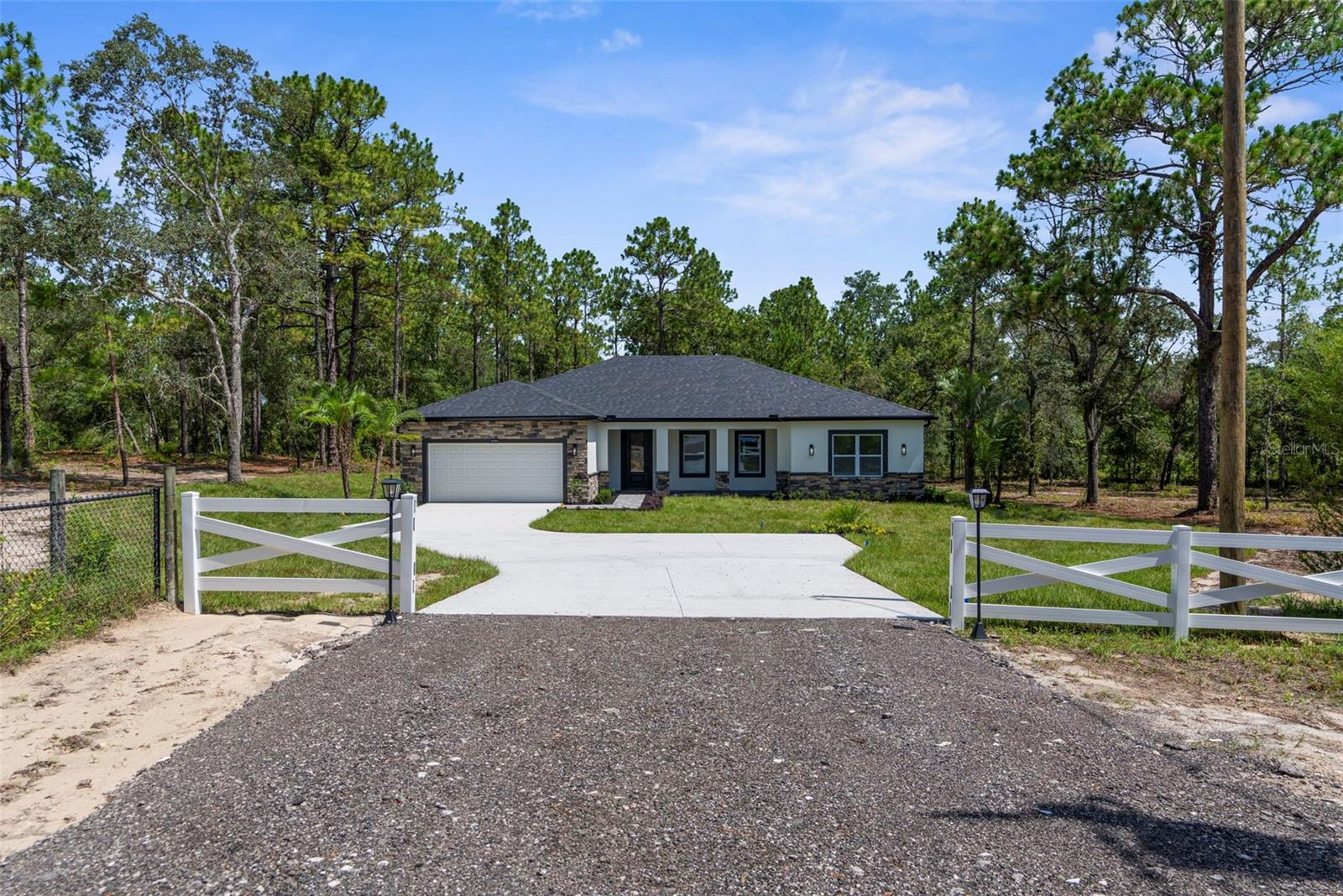 Luxury Meets Freedom on 2.5 Acres in Royal Highlands. Brooksville Florida!
Welcome to your dream home—a stunning 4-bedroom estate by Santabarbara Homes LLC, perfectly situated at the end of a quiet cul-de-sac on 2.5 private acres of high-and-dry land in Royal Highlands. Enjoy NO HOA, NO CDD, NO flood insurance required, and paved road access in a ZONED AG area—offering the freedom to live how you want.
Whether it’s horses, chickens, goats, or just room for all your toys, this property delivers true versatility and wide-open space—without sacrificing luxury.
Step inside and experience high-end finishes throughout: luxury vinyl plank flooring, matching Calcutta quartz countertops in the kitchen, baths, and laundry, and custom tray ceilings in the living room, dining room, and the expansive master suite.
The chef’s kitchen features upgraded appliances, double ovens, and a sleek layout designed for entertaining. The enormous master bedroom includes a massive walk-in closet with a custom organizing system and a spa-style en suite bath with a soaking tub, frameless glass shower, and designer tilework.
Enjoy an upgraded landscaping package with full irrigation across the entire property—front, back, and sides—with drip lines for easy maintenance. All impact windows and doors provide top-tier protection, energy efficiency, and peace of mind.
Just minutes from shopping, dining, and with easy access to Tampa via the 589/Suncoast Parkway, this home combines luxury, privacy, and freedom in one unbeatable package.
Come see the Santabarbara difference—where craftsmanship meets country comfort. Schedule your private showing today!
